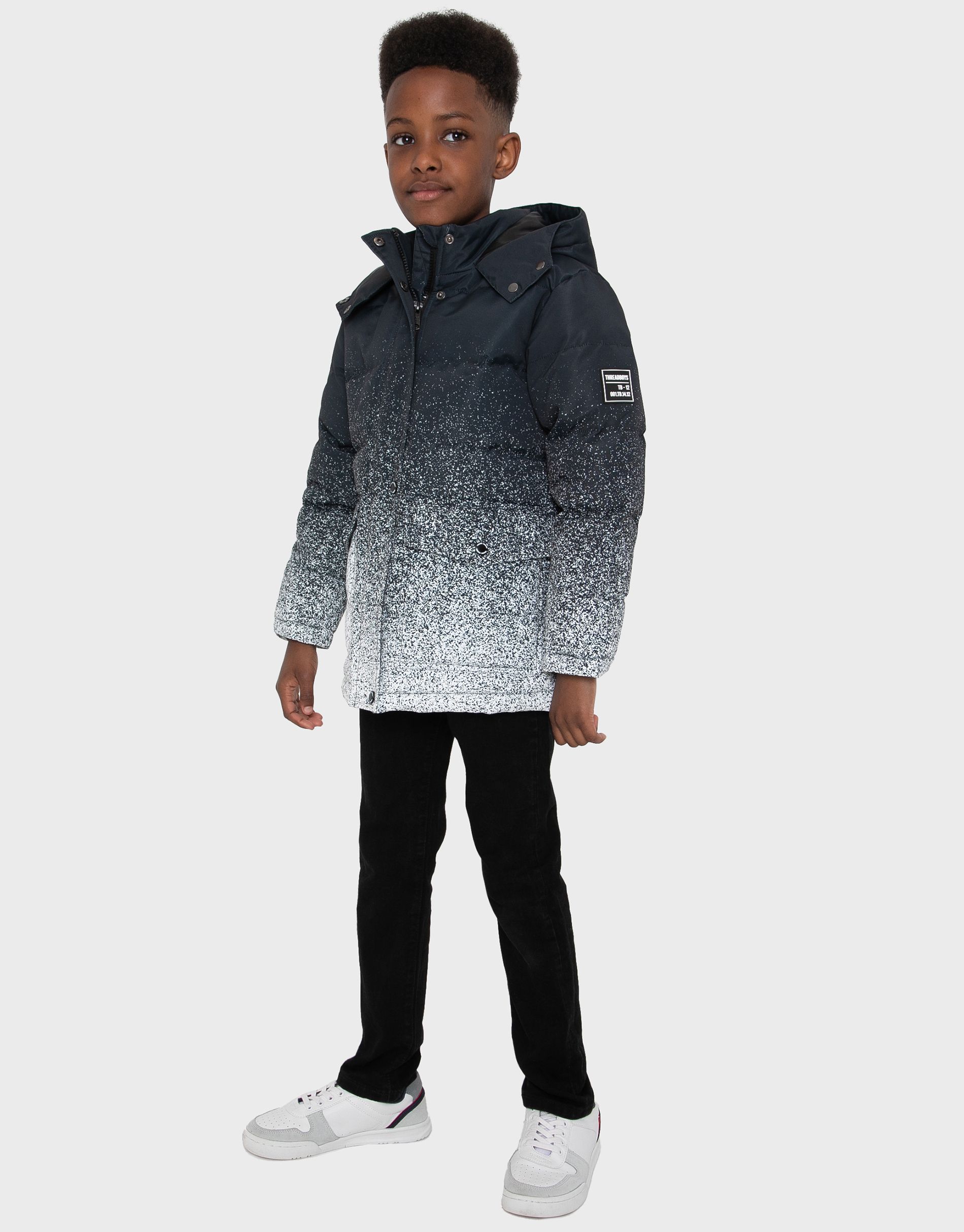 This hooded, padded jacket from Threadboys features two popper fastening front pockets and a storm guard concealing the zip fastening. It has a branded badge on the sleeve and elasticated hem and cuffs. The perfect addition to keep warm and dry this back to school season. Other styles available.