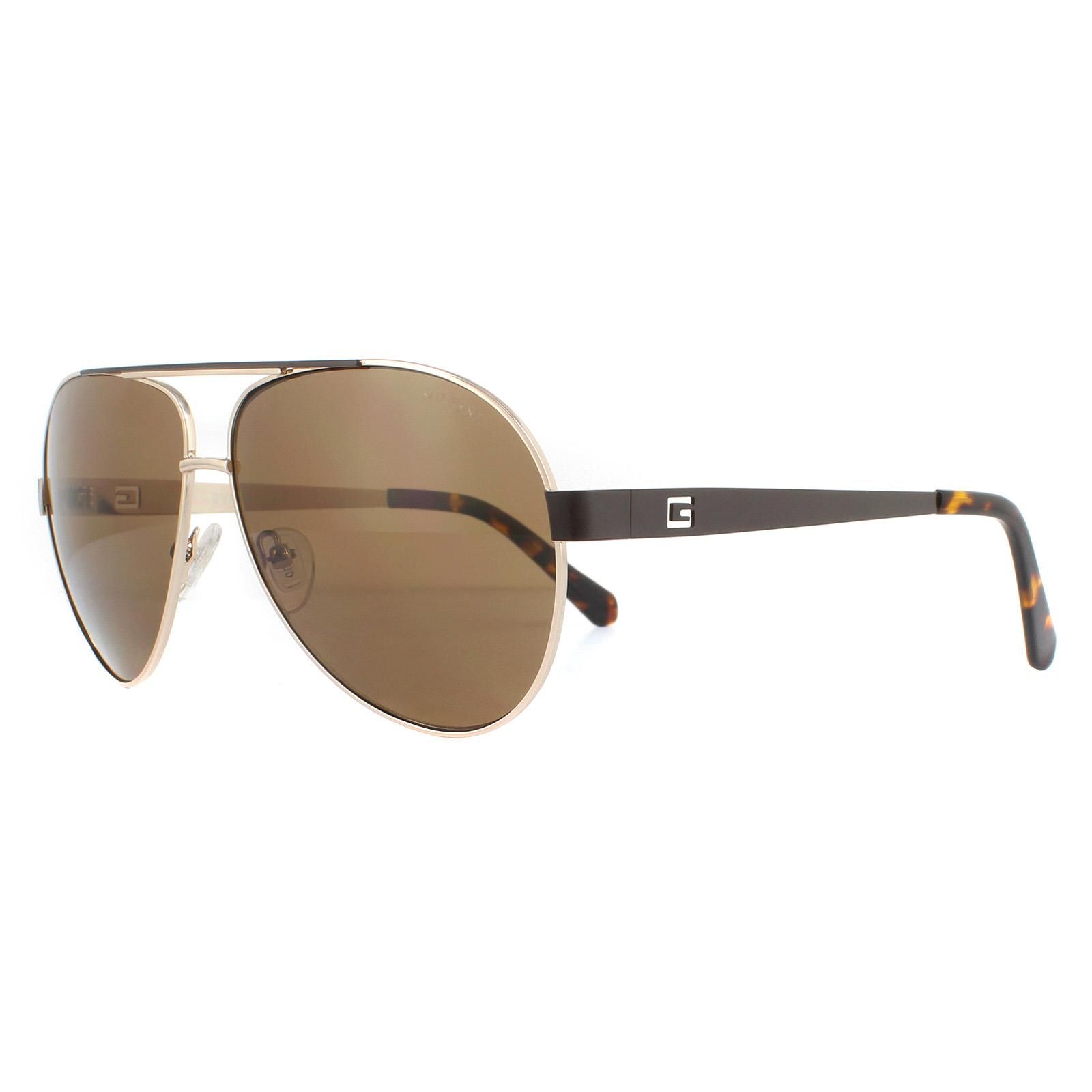 Guess Sunglasses GU6969 32H Gold Brown Polarized are a large lens aviator style with cut-out Guess G logo on the temples. The temple colours match the top brow bar for a unique two-tone effect.
