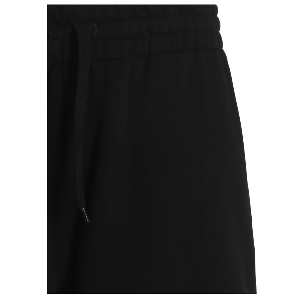 Cotton bermuda shorts with logo detail and drawstring at the waist.