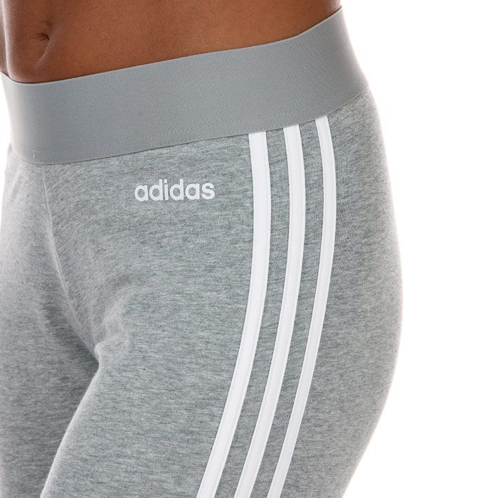 Womens adidas Essentials 3- Stripes Leggings in grey white.- Exposed elastic waist.- Regular length.- Contrast 3-Stripes.- Small logo on the hip.- Fitted fit.- 92% Cotton  8% Elastane.  Machine washable. - Ref: FQ4123