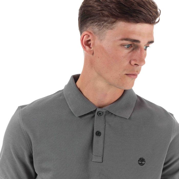 Mens Timberland Millers River Jacquard Polo Shirt in grey.<BR><BR>- Ribbed polo collar.<BR>- Jacquard stripe detail with print branding under the collar.<BR>- Two button placket.<BR>- Short sleeves with ribbed cuffs.<BR>- Even vented hem.<BR>- Contrast back neck tape.<BR>- Signature Timberland logo embroidered at left chest.<BR>- Soft and comfortable organic cotton piqué fabric.<BR>- Slim fit.<BR>- Measurement from shoulder to hem: 27“ approximately.<BR>- 100% Organic cotton.  Machine washable.<BR>- Ref: TB0A1YQ9 033<BR><BR>Measurements are intended for guidance only.