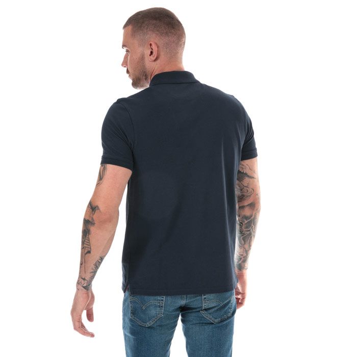 Mens Timberland Millers River Jacquard Polo Shirt in navy.<BR><BR>- Ribbed polo collar.<BR>- Jacquard stripe detail with print branding under the collar.<BR>- Two button placket.<BR>- Short sleeves with ribbed cuffs.<BR>- Even vented hem.<BR>- Contrast back neck tape.<BR>- Signature Timberland logo embroidered at left chest.<BR>- Soft and comfortable organic cotton piqué fabric.<BR>- Slim fit.<BR>- Measurement from shoulder to hem: 27“ approximately.<BR>- 100% Organic cotton.  Machine washable.<BR>- Ref: TB0A1YQ9 433<BR><BR>Measurements are intended for guidance only.