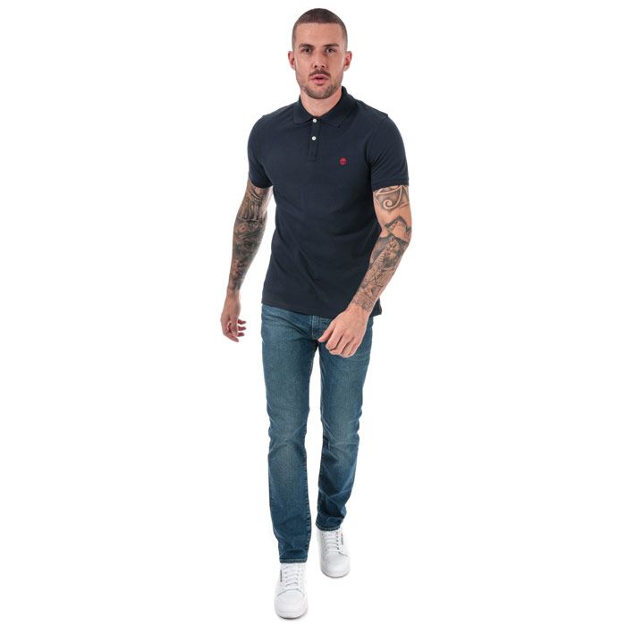 Mens Timberland Millers River Jacquard Polo Shirt in navy.<BR><BR>- Ribbed polo collar.<BR>- Jacquard stripe detail with print branding under the collar.<BR>- Two button placket.<BR>- Short sleeves with ribbed cuffs.<BR>- Even vented hem.<BR>- Contrast back neck tape.<BR>- Signature Timberland logo embroidered at left chest.<BR>- Soft and comfortable organic cotton piqué fabric.<BR>- Slim fit.<BR>- Measurement from shoulder to hem: 27“ approximately.<BR>- 100% Organic cotton.  Machine washable.<BR>- Ref: TB0A1YQ9 433<BR><BR>Measurements are intended for guidance only.