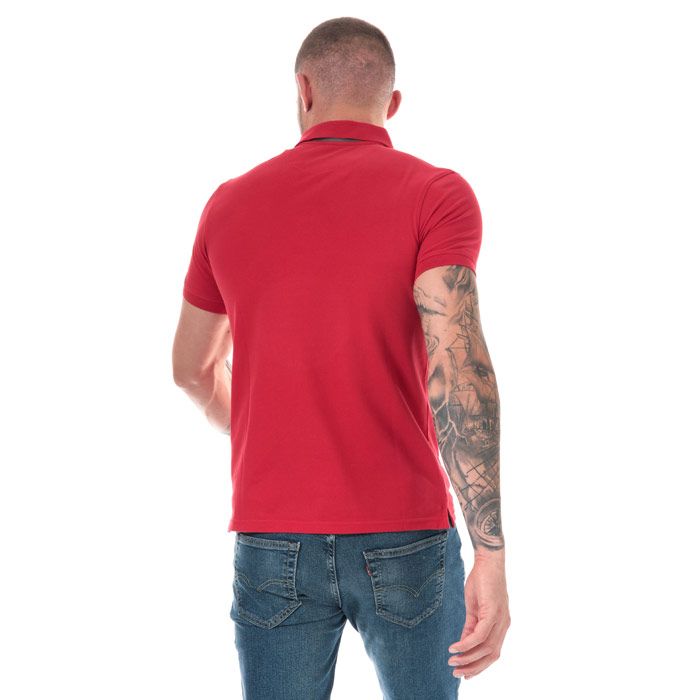 Mens Timberland Millers River Jacquard Polo Shirt in red.<BR><BR>- Ribbed polo collar.<BR>- Jacquard stripe detail with print branding under the collar.<BR>- Two button placket.<BR>- Short sleeves with ribbed cuffs.<BR>- Even vented hem.<BR>- Contrast back neck tape.<BR>- Signature Timberland logo embroidered at left chest.<BR>- Soft and comfortable organic cotton piqué fabric.<BR>- Slim fit.<BR>- Measurement from shoulder to hem: 27“ approximately.<BR>- 100% Organic cotton.  Machine washable.<BR>- Ref: TB0A1YQ9 P92<BR><BR>Measurements are intended for guidance only.