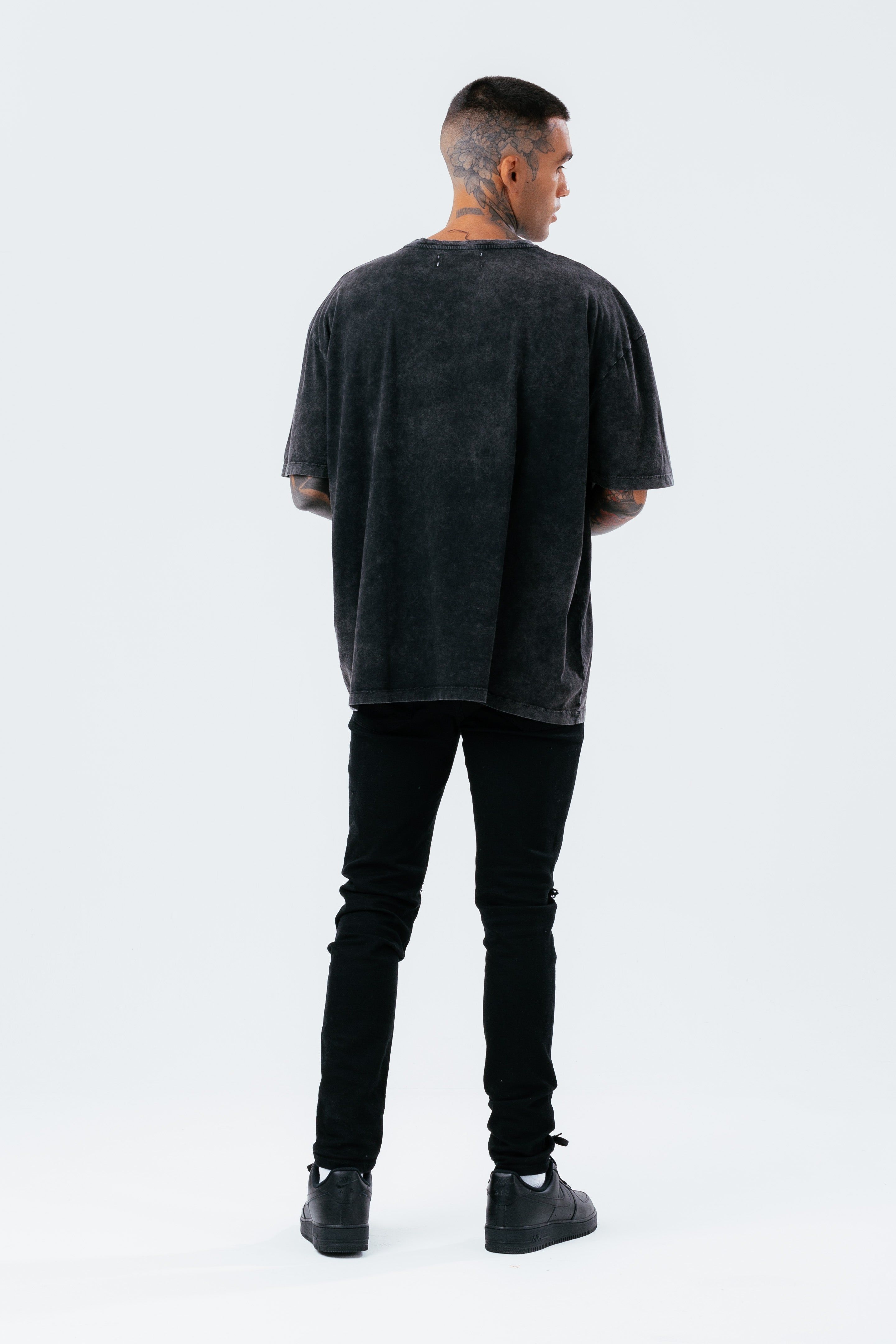 The HYPE. Men's Oversized T-shirt boasts a soft touch fabric base for supreme comfort. Designed in our oversized men's tee shape, with a crew neckline and enlarged sleeves for a trending fit. The model wears a size M. Machine washable.