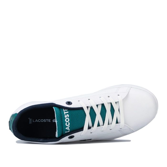Junior Lacoste Carnaby Evo Trainers in White & Red.<BR>- Lace fastening <BR>- Cushioned Ortholite® insole <BR>- Lightly padded collar <BR>- Striped heel strip <BR>- Branding to heel  side and tongue <BR>- Synthetic Upper  Textile Lining  Synthetic Sole <BR>- Ref: 739SUJ0001082