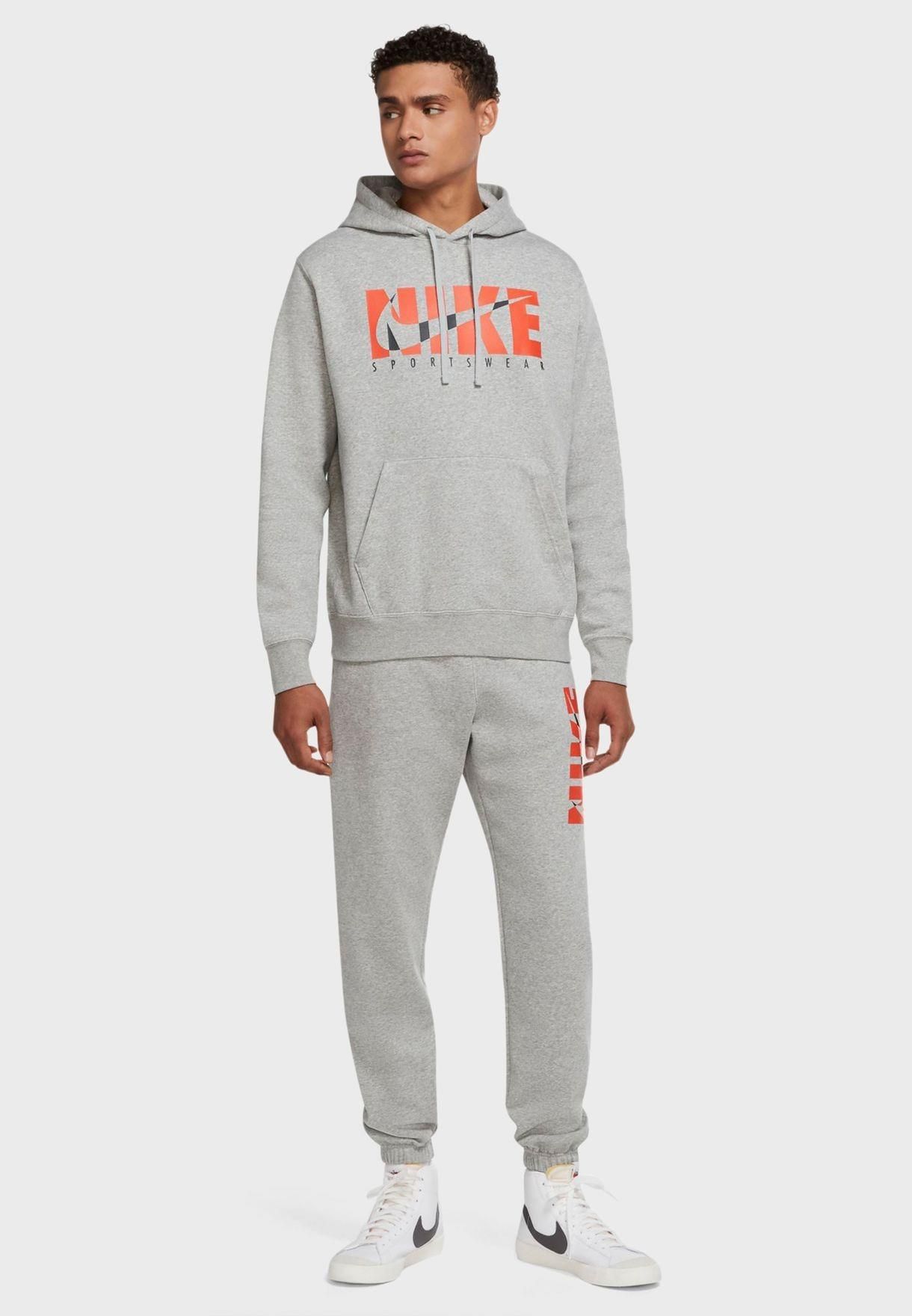 Nike Mens Fleece Hooded Pullover Tracksuit.        
Soft Poly-cotton Blend Light Fleece Fabric.        
Single Pouch Kangaroo Pocket with Dual Side Openings.        
Sweatpants with Elasticised Waist and Hidden Drawstrings.        
Self-Cuffed Hem Joggers.        
Dual Side and Single Wallet Pocket.        
Nike Signature Sportswear Branding Print.