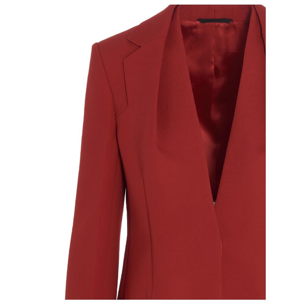 Givenchy virgin wool single breast V-neck blazer jacket featuring a V-neck without lapels and covered buttons.