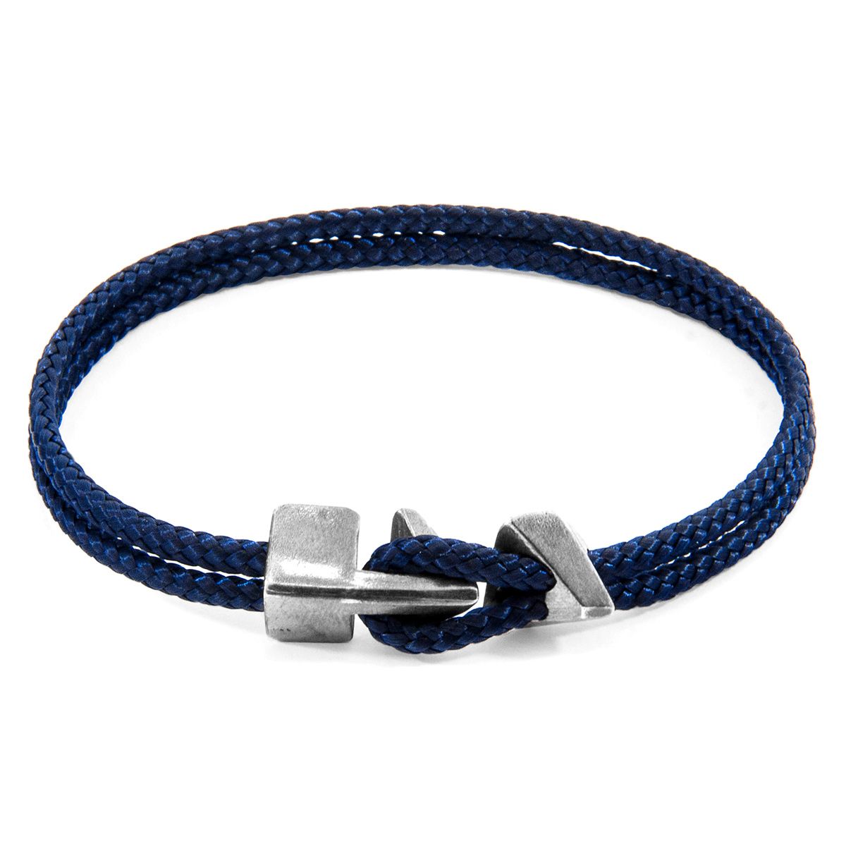 The Navy Blue Brixham Silver and Rope Bracelet was both designed and skilfully handcrafted completely in Great Britain, In Quality We Trust. For the Modern Journeyman (and woman), ANCHOR & CREW takes ownership of an exploratory lifestyle and enjoys the Happy-Good Life. Combining British craft manufacturing with a discerning modern-minimalist style, this ANCHOR & CREW bracelet features:

3mm diameter performance Marine Grade polyester and nylon rope (GB) 
Secure solid .925 sterling silver facetted arrow-shaped clasp and matching angled clamp (GB) 
SIZING
This bracelet is available in four bracelet lengths, 17cm, 19cm, 21cm or 23cm in circumference. To take the bracelet on or off your wrist, simply (un)hook the loop from beneath the arrow-shaped clasp and slide the matching angled clamp for added security.