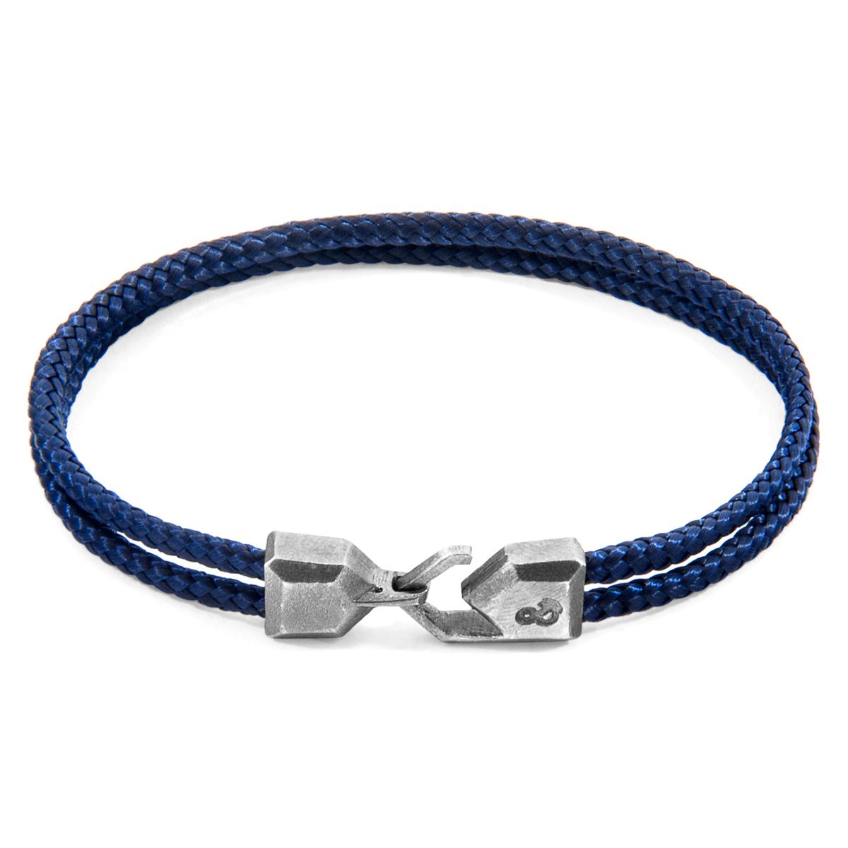The Navy Blue Cromer Silver and Rope Bracelet was both designed and skilfully handcrafted completely in Great Britain, In Quality We Trust. For the Modern Journeyman (and woman), ANCHOR & CREW takes ownership of an exploratory lifestyle and enjoys the Happy-Good Life. Combining British craft manufacturing with a discerning modern-minimalist style, this ANCHOR & CREW bracelet features:

3mm diameter performance Marine Grade polyester and nylon rope (GB) 
Secure solid .925 sterling silver facetted lantern clasp and hook (GB) 
SIZING
This bracelet is available in four bracelet lengths, 17cm, 19cm, 21cm or 23cm in circumference. To take the bracelet on or off your wrist, simply slot the hook into the facetted lantern clasp and secure.