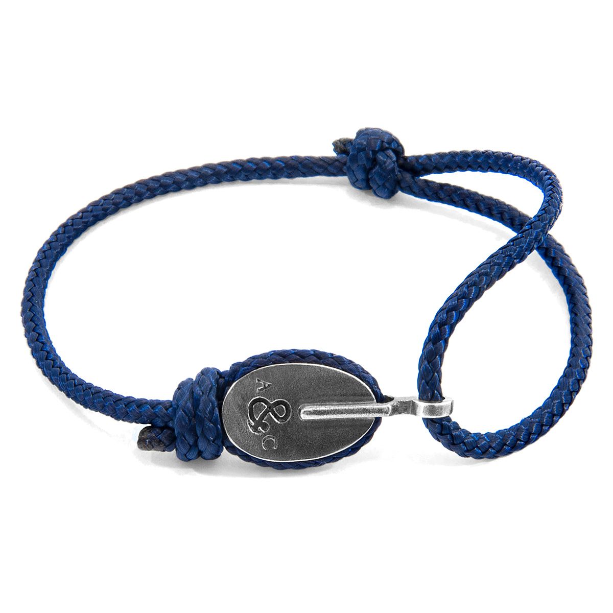 The Navy Blue London Silver and Rope Bracelet was both designed and skilfully handcrafted completely in Great Britain, In Quality We Trust. For the Modern Journeyman (and woman), ANCHOR & CREW takes ownership of an exploratory lifestyle and enjoys the Happy-Good Life. Combining British craft manufacturing with a discerning modern-minimalist style, this ANCHOR & CREW bracelet features:

3mm diameter performance Marine Grade polyester and nylon rope (GB) 
Secure solid .925 sterling silver pulley (GB) 

SIZING
This bracelet is one size fits all, with the rope able to extend or tighten to suit your wrist size. To take the bracelet on or off your wrist, simply slide the one adjustable knot around the rope to make the loop size smaller or larger. Less is More.