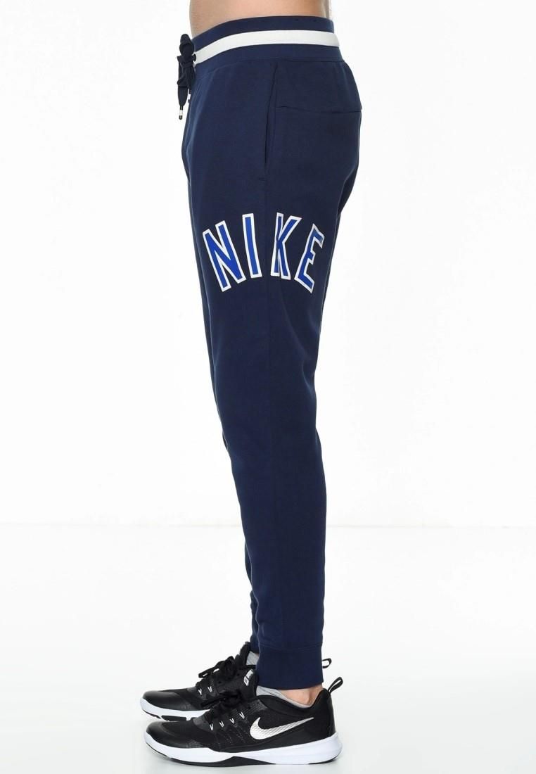 Nike Air Mens Zip Through Tracksuit Set in Navy.  
Drawstring Hood, Zip Closure, Embroidered Swoosh.   
Printed Branding, Split Kangaroo Pouch Pocket.   
Woven Brand Patch, Ribbed Cuffs & Hem.  
Elasticated Waist Band.   
Elasticated Drawstring Waist Joggers.   
Ribbed Bottom Leg Cuffs for Comfort Fit.