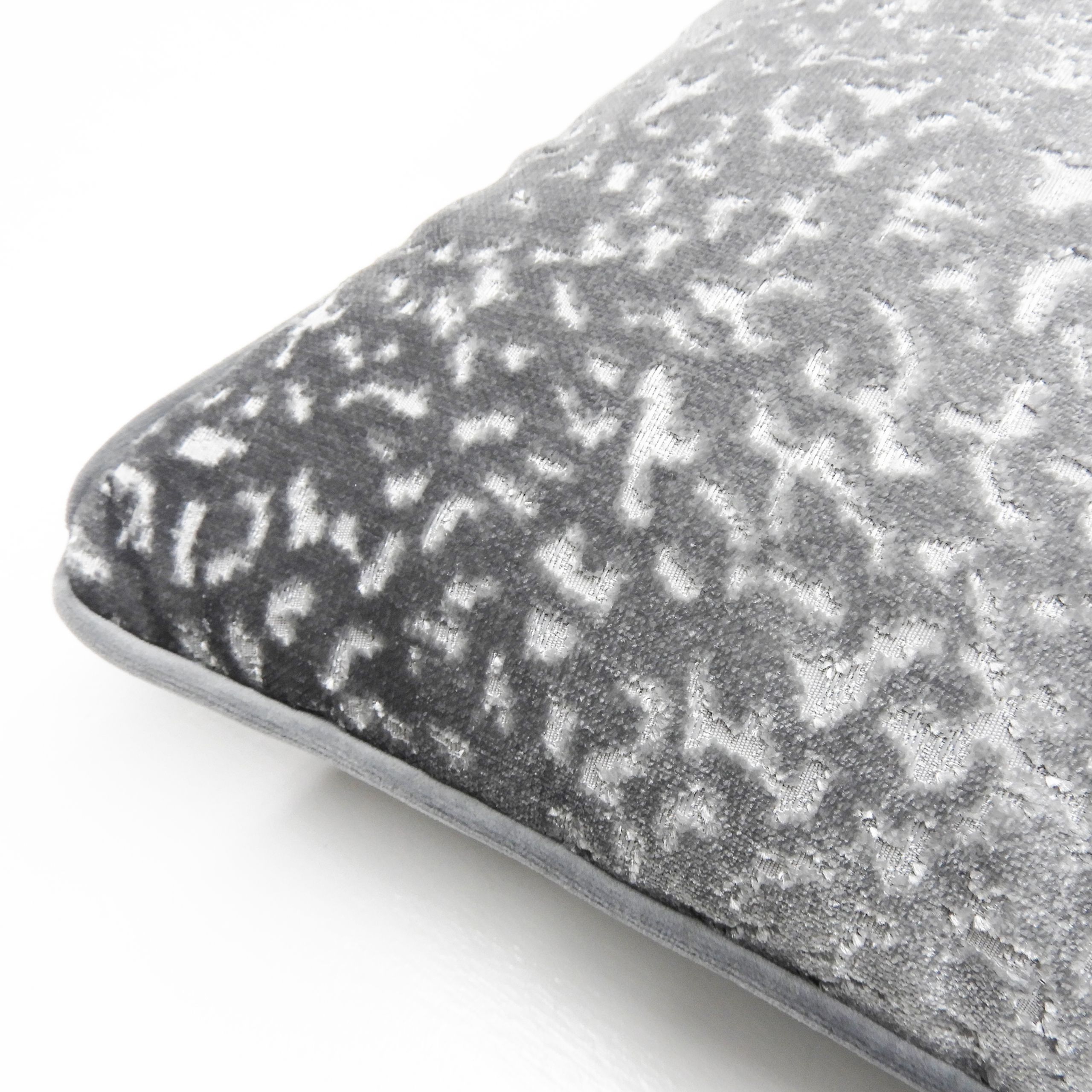 A luxurious sculpted velvet cushion with exquisite co-ordinating plain velvet piping.