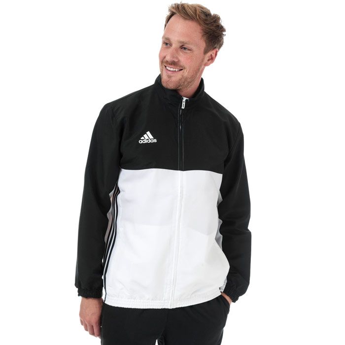 Mens adidas T16 Team Jacket in black - white.<BR><BR>- climalite fabric sweeps sweat away from your skin.<BR>- Stand up collar.<BR>- Full zip fastening.<BR>- Long sleeves with elasticated cuffs.<BR>- Zipped front welt pockets.<BR>- Elasticated hem.<BR>- Mesh lined back and upper sleeves.<BR>- Applied 3-Stripes to sides.<BR>- adidas Badge Of Sport logo printed at right chest.<BR>- Branded back neck tape.<BR>- Regular fit.<BR>- Main material: 100% Recycled polyester. Machine washable.<BR>- Ref: AJ5382