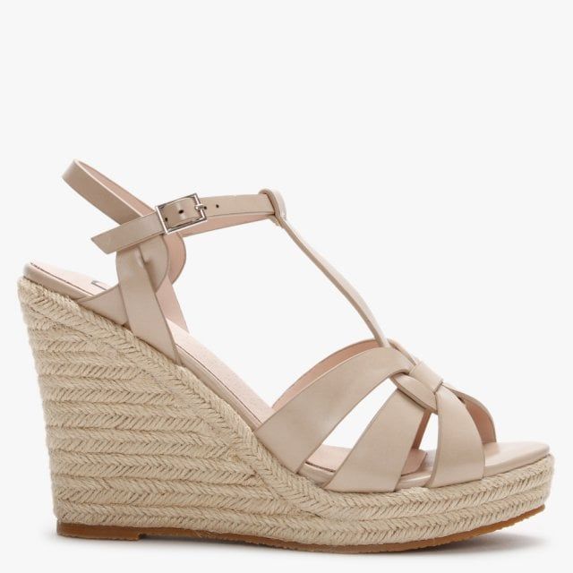 The DF By Daniel Amberna Cut Away Espadrille Wedge Sandals are part of the New Season collection. This everyday Summer style is crafted from a premium faux leather upper featuring a classic jute trim and comfy rubber sole. The buckle fastening ankle strap provides an easy wear as well as ensuring the perfect fit. The cut away design to the upper adds detail. Signature DF By Daniel branding is seen on the foot-bed.