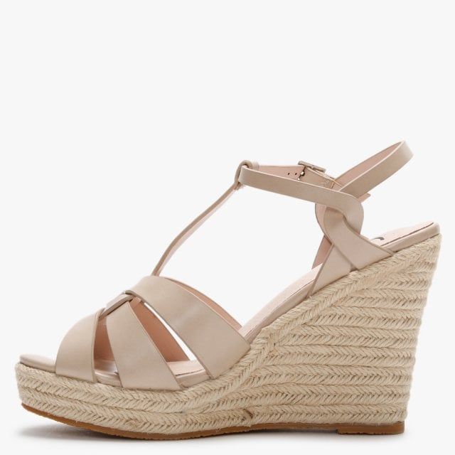 The DF By Daniel Amberna Cut Away Espadrille Wedge Sandals are part of the New Season collection. This everyday Summer style is crafted from a premium faux leather upper featuring a classic jute trim and comfy rubber sole. The buckle fastening ankle strap provides an easy wear as well as ensuring the perfect fit. The cut away design to the upper adds detail. Signature DF By Daniel branding is seen on the foot-bed.