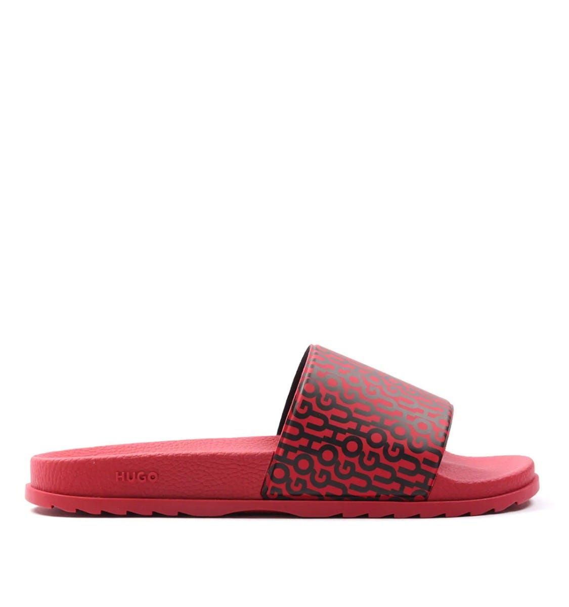 Slide your feet into standout style with the Match Slides from HUGO. These lightweight quicky drying slides are ready to make a statement with the iconic HUGO logo repeat printed across the rubberised foot straps.  Perfect for the pool, beach, garden or even lounging around. Featuring an ergonomically designed footbed for optimum comfort and a non slip outsole. Synthetic Rubber Composition, Ergonomic Designed Footbed, Non Slip Outsole, Made in Italy, HUGO Branding.