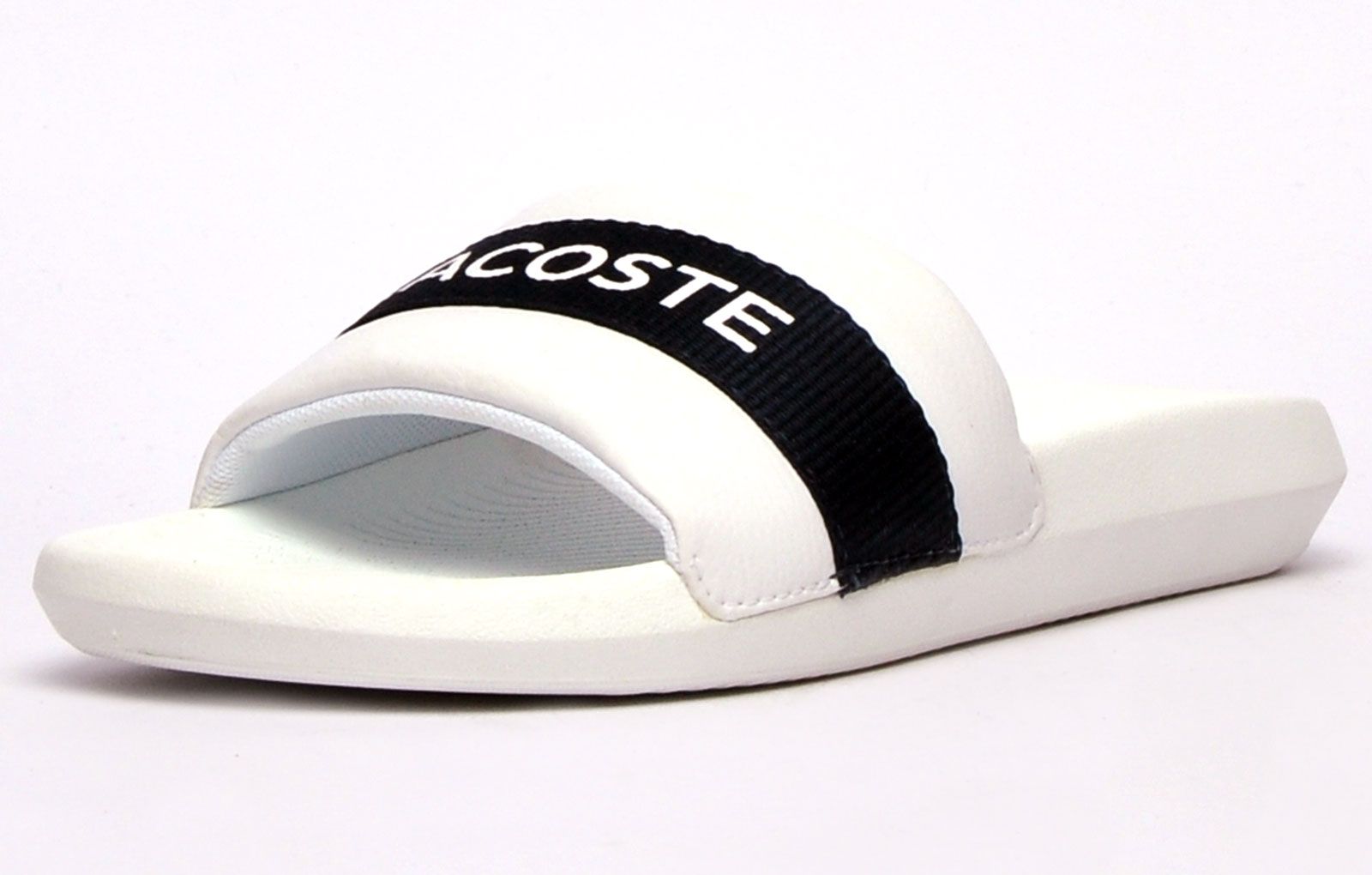 Step into on trend summer style with these mensCroco Slides from Lacoste. In a classic colourway, these designer sandals are delivered in a smooth synthetic upper with band stripe detailing across the forefoot foot strap. The super comfy moulded footbed delivers the perfect fit and feel while the grippy outsole will keep you sure and safe around the pool or in the shower. These designer slides are finished with eye catching Lacoste branding throughout just in case you want a sign of approval that youre wearing cool on trend style this summer season 
 
 - Synthetic comfort upper
 - Comfort moulded footbed
 - Single strap construction
 - Grippy outsole
 - Slip on wear
 - Iconic Lacoste branding throughout
 Please Note: These slides are supplied poly bagged (without box)
 These Lacoste Slides are sold as B grades which means there may be some very slight cosmetic issues on the shoe and they come in a poly bag. There could be occasional issues with wrong swing tags being allocated to wrong shoes by Lacoste themselves which could result in some size confusion but you must take the size IN THE SHOE as the size that the shoe actually is ( not what is on the tag ). We have checked most of the shoes and in our opinion,all are practically perfect without any blemishes on them at all and in essence if the shoes did not have the letter B denoted on the swing tag you would presume these were perfect shoes. All shoes are guaranteed against fair wear and tear and offer a substantial saving against the normal high street price. The overall function or performance of the shoe will not be affected by any minor cosmetic issues. B Grades are original authentic products released by the brand manufacturer with their approval at greatly reduced prices. If you are unhappy with your purchase, we will be more than happy to take the shoes back from you and issue a full refund