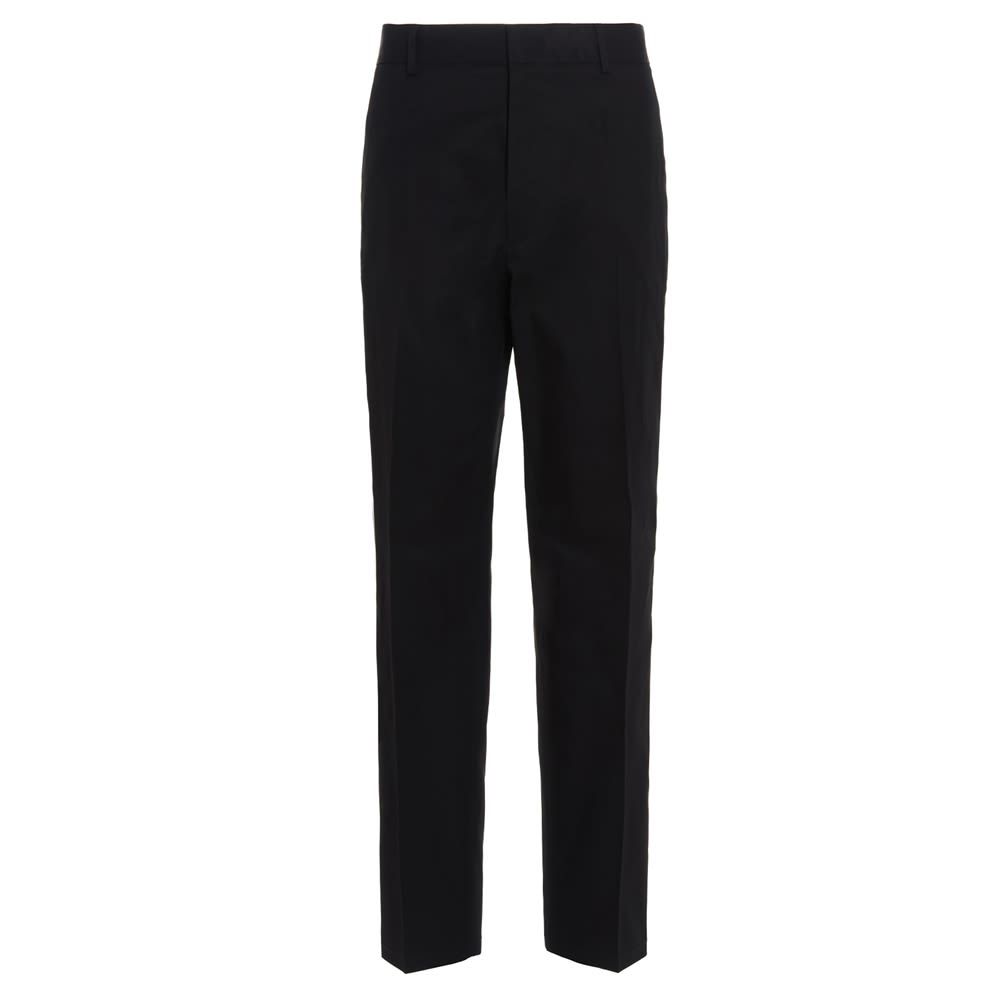 Gabardine cotton trousers with an elastic waistband, welt pockets and a double pocket at the back.  Tapered cropped relaxed fit.