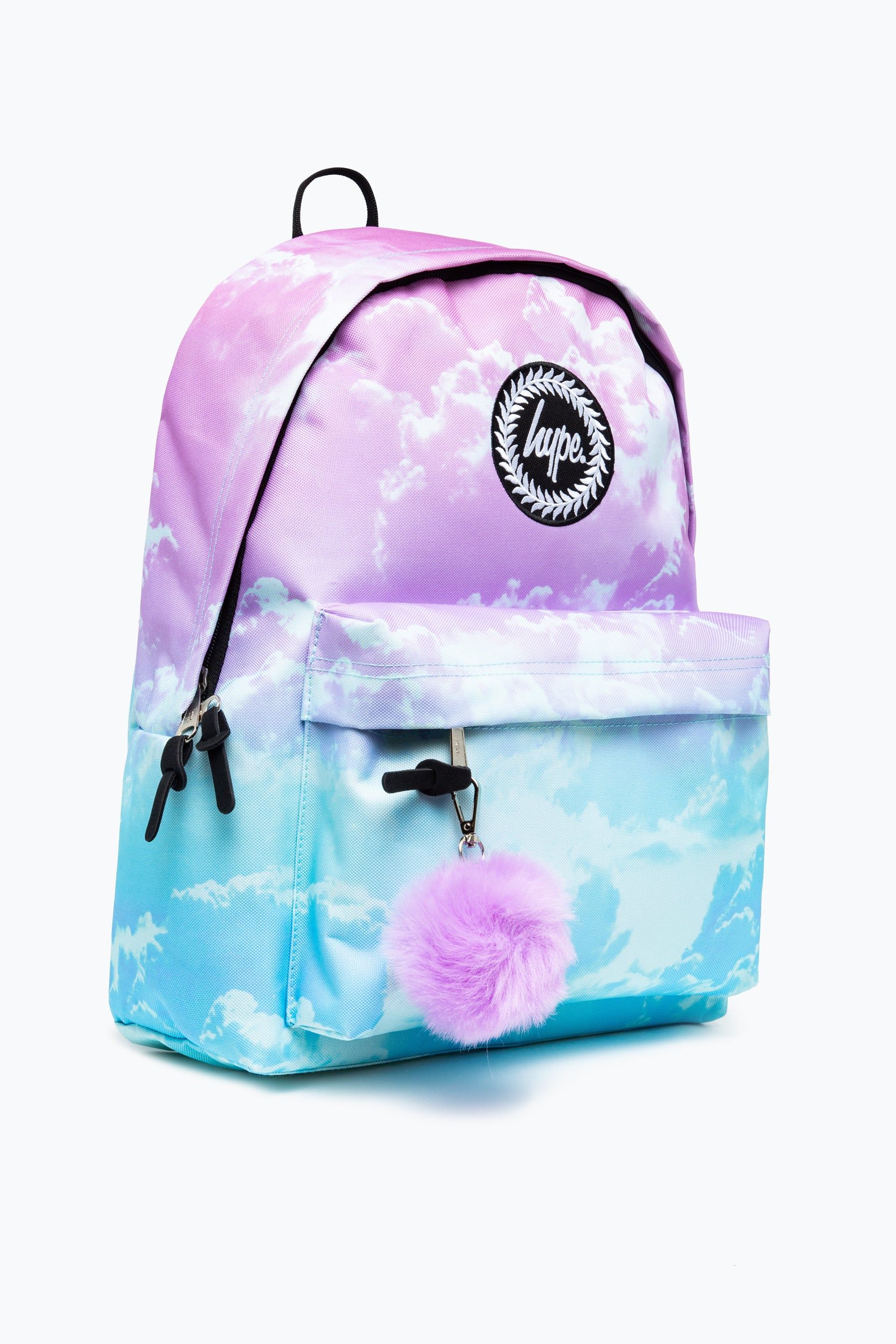 Living life on Cloud 9. The HYPE. Lilac Cloud Backpack is the ultimate summer accessory. Designed with a trending all-over cloud print combined with our signature gradient effect in a pastel pink and baby blue colour palette. Measuring at 42cms x 30cms x 12cms, finished with a front mini pocket, grab handle, embossed zips and inside branded lining. Finished with the iconic HYPE. crest badge in monochrome embroidered on the front. The straps offer supreme comfort with just the right amount of padding. Wipe clean only.