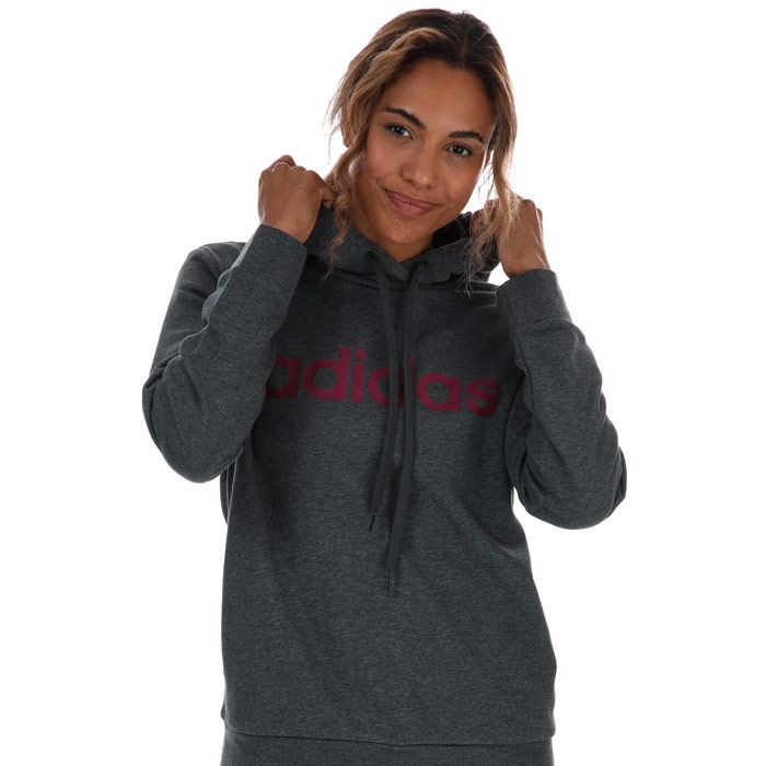 Womens adidas Essentials Linear Hoody in charcoal marl.- Crossover neckline.- Long sleeves.- Two side pockets.- Ribbed cuffs.- adidas logo across the chest.- Regular fit.- 52% Cotton  48% Polyester (Recycled) . Hood lining: 100% Cotton.  Machine washable. - Ref: GD2963