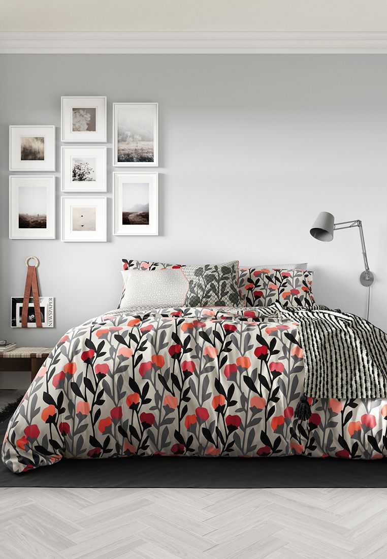 A floral design with a distinctive Scandi feel, ‘Ava’ presents an all over pattern of flowers in a palette of stone and charcoal with vivid coral pops. The reverse, made up of a modern circular geo pattern all over adds a contemporary edge.  Includes Pillowcase(s). Machine Washable. Made in Pakistan.