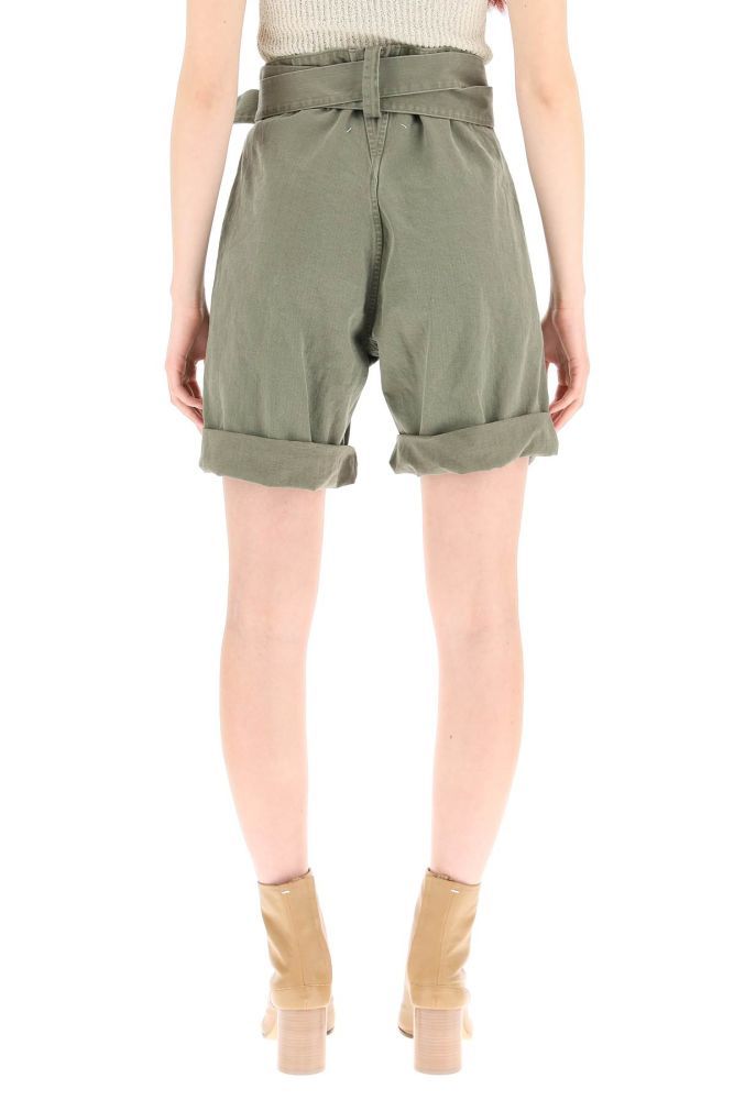 Maison Margiela shorts in pure cotton herringbone twill with very high waist and cuffed hem. Oversized belt loops, self-fabric belt with sliding buckle, button fly with hidden hook-and-eye, side pockets. Signature four-stitches moniker on the back. The model is 177 cm tall and wears a size IT 38.