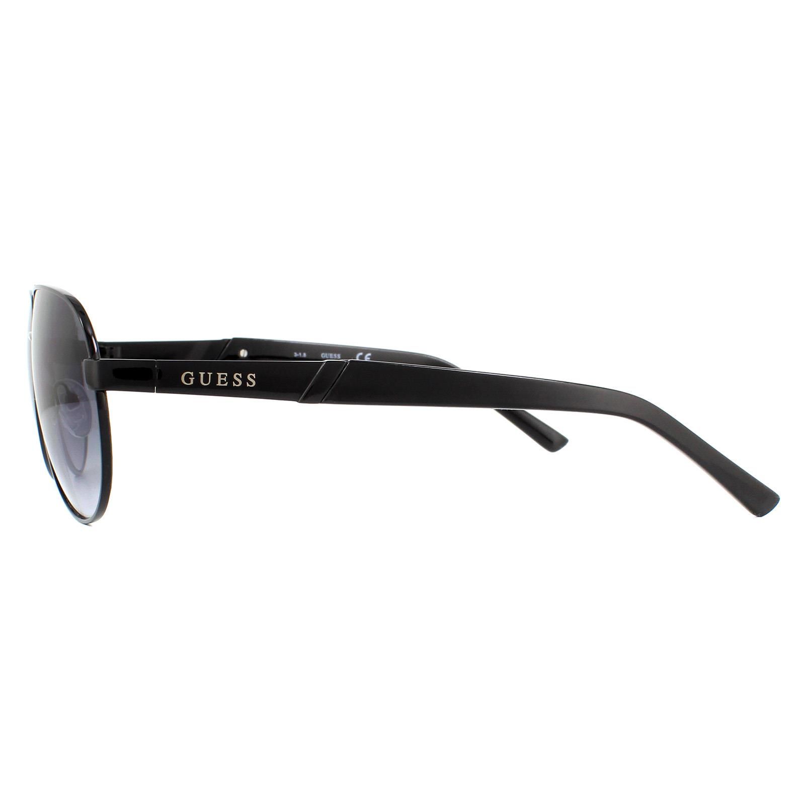 Guess Sunglasses GF5031 01B Black Grey Gradient are a stylish pilot style with a sold metal frame which then merges diagonally, halfway down the arms after the Guess logo, into plastic temple tips.