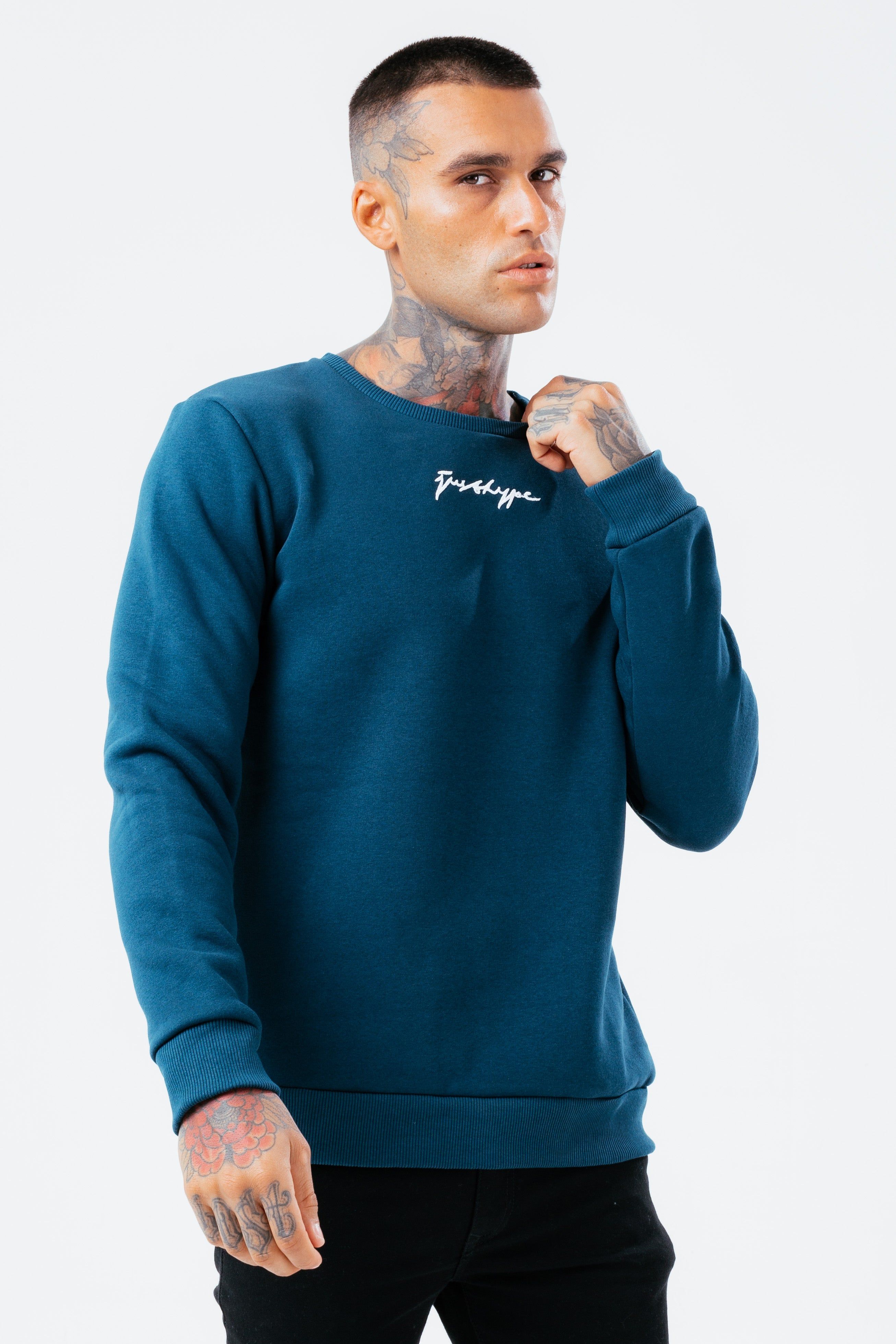 The HYPE. Men's Crew Neck Jumper is designed in our mens standard jumper shape. With a soft touch fabric base for supreme comfort. With a crew neckline, long sleeves, fitted cuffs and hem. The model wears a size M. If you like an oversized fit, go up a size, if you like a tight fit go down a size, for a standard fit, select your usual size. Machine washable.