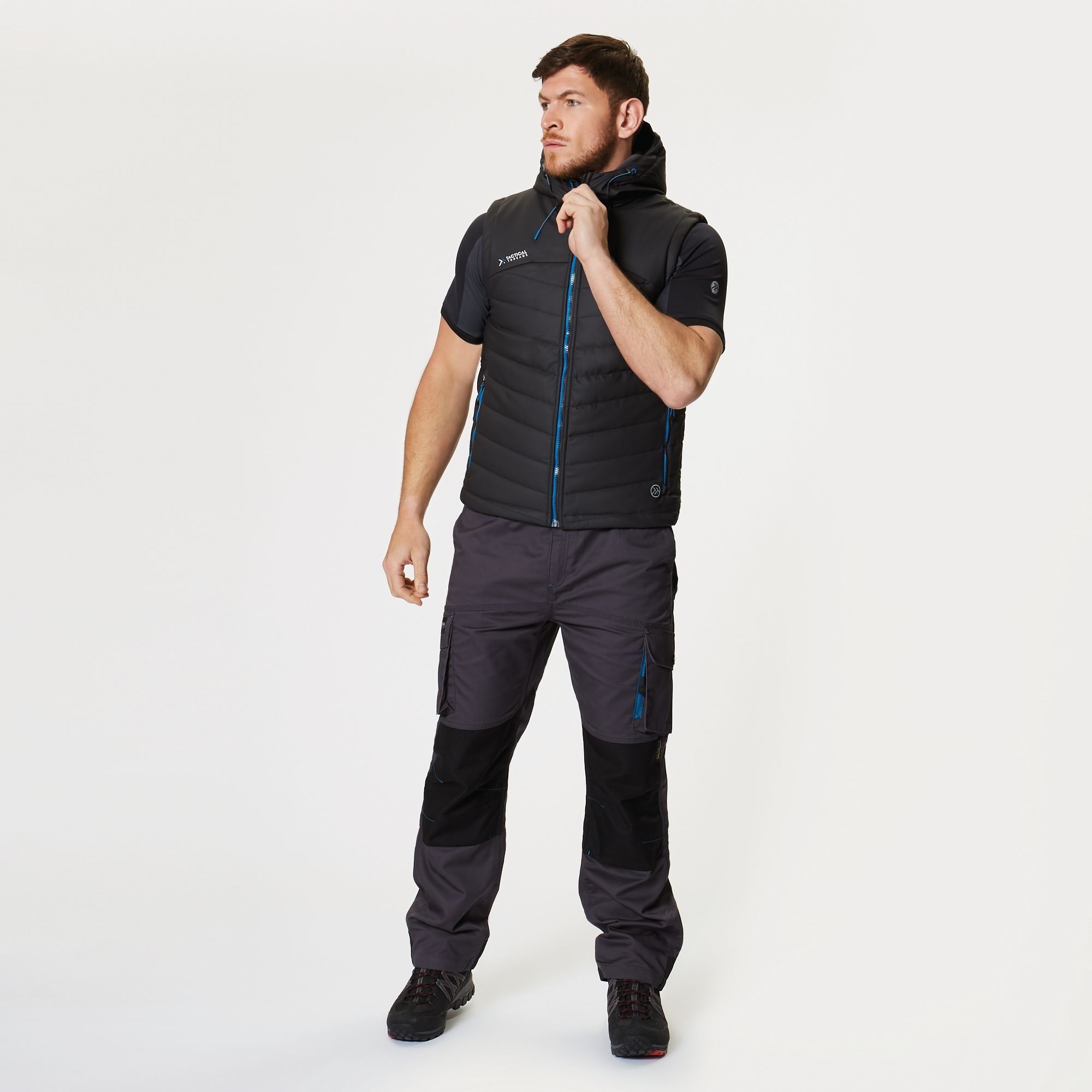 100% Polyester. Light weight and warm, thermo-guard wadding enables you to move freely, and four zipped pockets are perfect for your tape measure and other tools. When work is finished and the bar calls, the easy clean fabric can be wiped down for a fresh look. Water resistant and windproof PU coated polyester.