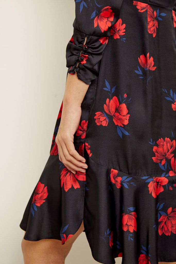 REASONS TO BUY: 

Bold blooms to brighten your day
Silky fabric for a luxe finish
Flattering V-neck, ruched sleeves, fluted hem – we’ve thought of everything
Sexy cut out detail – the back is where its at
Swish your way from day to night
Keep it classic with courts, add edge with ankle boots