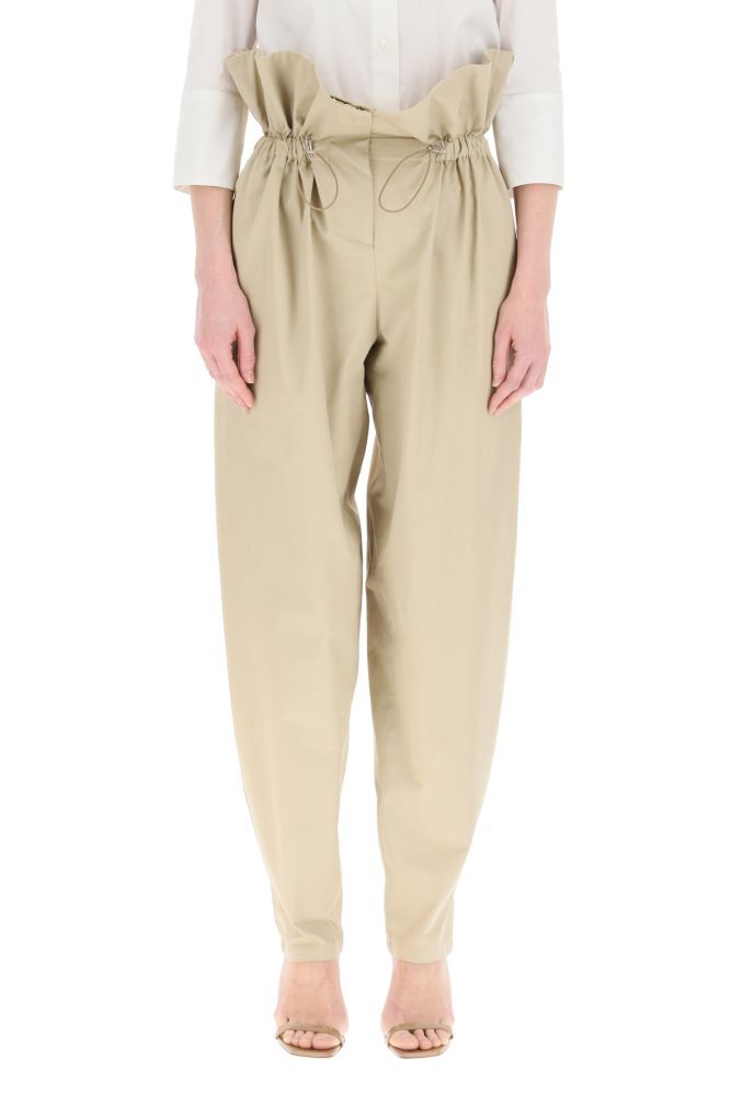 WANDERING trousers in cotton gabardine with wide leg and tapered hem, enhanced by a high corolla waist gathered with an elastic drawstring. Front concealed zip closure, side slash pockets. The model is 177 cm tall and wears a size IT 38.