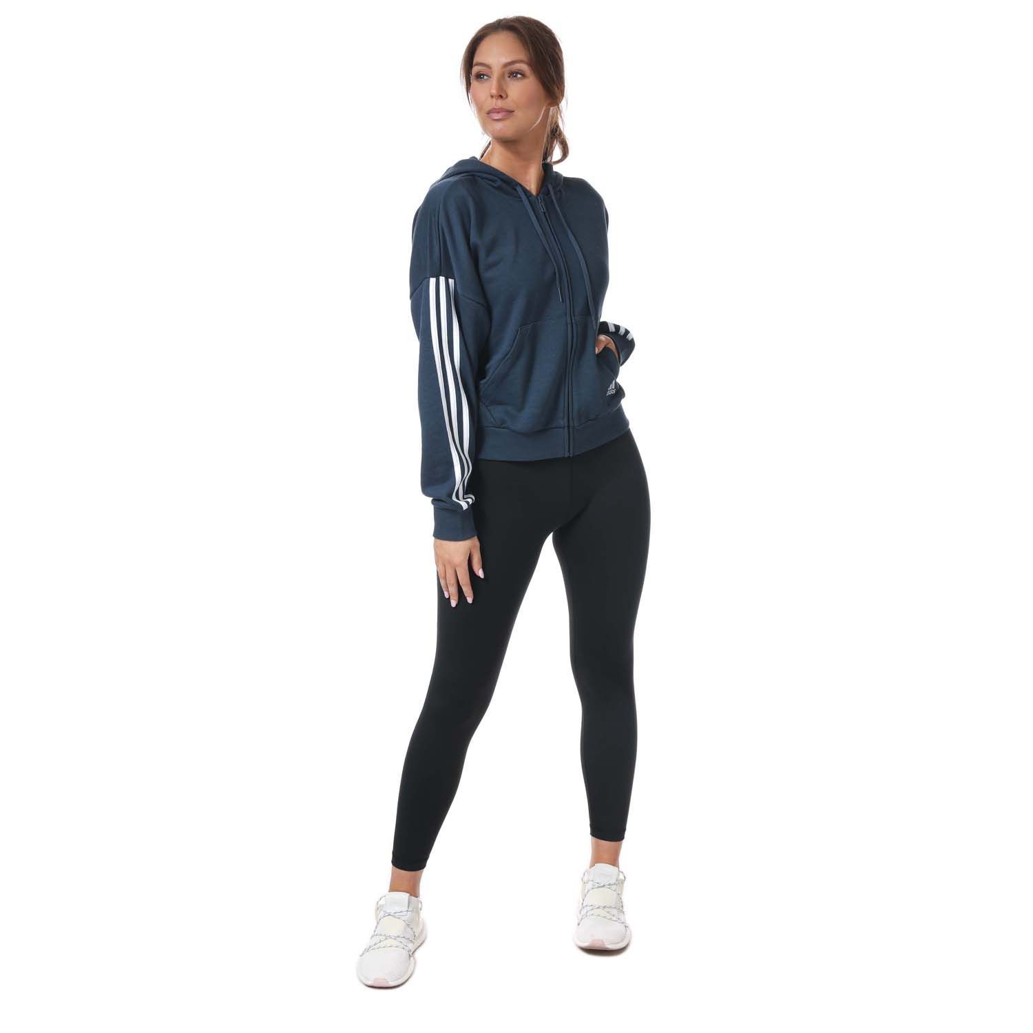 Womens adidas Essentials 3- Stripes Zip Hoody in navy.- Lined drawcord hood. - Long sleeves.- Full fastening.- Split pouch pocket.- Ribbed cuffs and hem.- Embroidered branding.- Straight hem.- Main Material: 53% Cotton  36% Polyester (Recycled)  11% Rayon. Hood Lining: 100% Cotton.- Ref: GL1463
