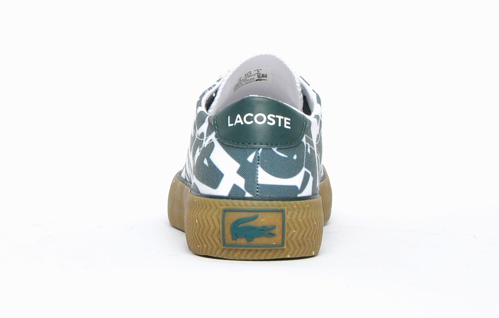 With its premium construction and classic plimsol silhouette presented in a smart white colourway with a bold all over graphic green print, these Lacoste Gripshot trainers deliver a look thats both casual and stylish. A durable rubber outsole and full lace closure, mean these Lacoste Gripshot trainers are full of designer touches, premium craftmanship and finished off with the famous Lacoste Croc on the side, this classic trainer will deliver a touch of laid-back style to any casual or dress outfit. - Premium canvas / textile / synthetic mix upper
 - Classic lace up fit
 - Ortholite comfort footbed
 - Textured vintage styled midsole
 - Durable rubber outsole
 - Lacoste branding throughout