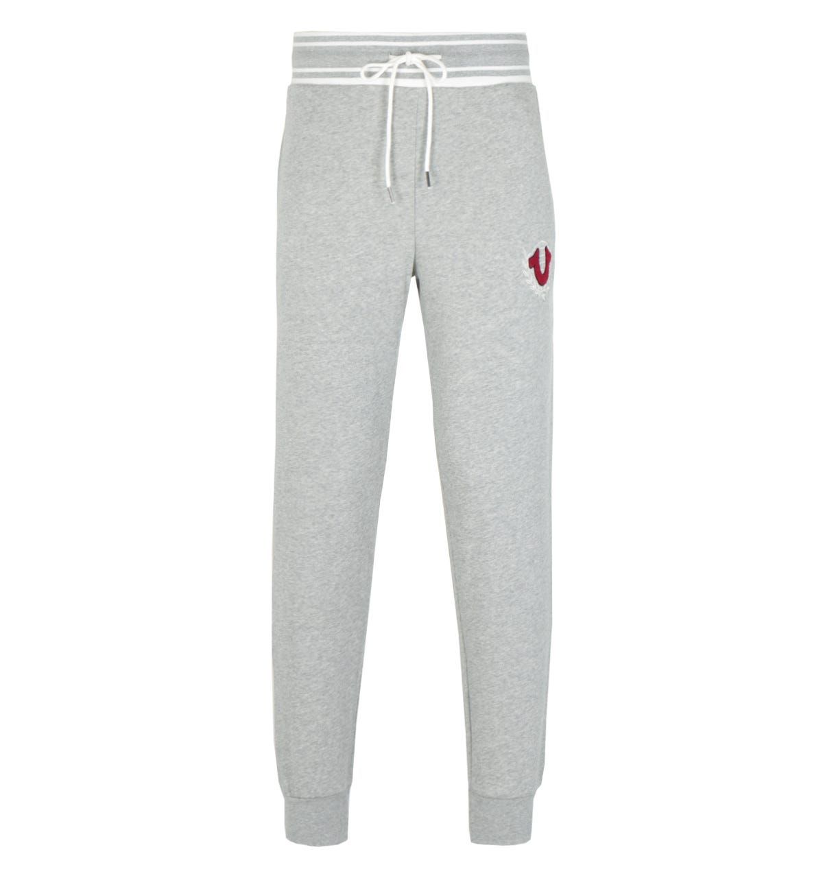 <p>Upgrade your wardrobe with the Collegiate Logo Crest Joggers in Heather Grey by True Religion\nTrue Religion are global denim experts who have redesigned and reinvented the traditional 5 pocket jean. They were founded in L.A. back in 2002 and quickly became known for quality craftsmanship, bold design and the iconic lucky horseshoe logo.</p><ul><li>Cotton blend construction</li><li>Elastic waistband</li><li>Tapered ankle hem</li><li>On-seam side pockets</li><li>Back patch pocket</li><li>Varsity-inspired chenille horseshoe crest at the hip</li></ul><p>Style & Fit:</p><ul><li>Regular fit</li><li>Joggers</li></ul><p>Fabric Composition & Care:</p><ul><li>60% Cotton 40% Polyester</li><li>Machine wash</li></ul>