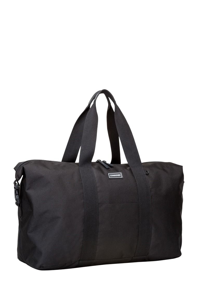 The Pegasus holdall is our ultimate weekender. Constructed in our core 400D Nylon and trimmed with our heavy cotton webbing and rubberised trims, the oversized design makes this an ideal grab-and-go bag, ready for any situation the urban environment can throw at it. Features include external side clips allowing you to combine the wearability of a tote bag with the oversized nature of a holdall. Features: , Core 400D Nylon, Adjustable exterior side pop clips, CONSIGNED seal of approval black & white rubberised logo, Main compartment zip top opening, Front slip pocket, Rubberised black external & internal zip pullers, Rubberised grab handle, Internal 15 inch padded laptop pocket & nested tech pocket with adjustable Velcro fastening, Inner slips and zip pocket, Black on black CONSIGNED logo lining Style Ref: 50233 BLACK