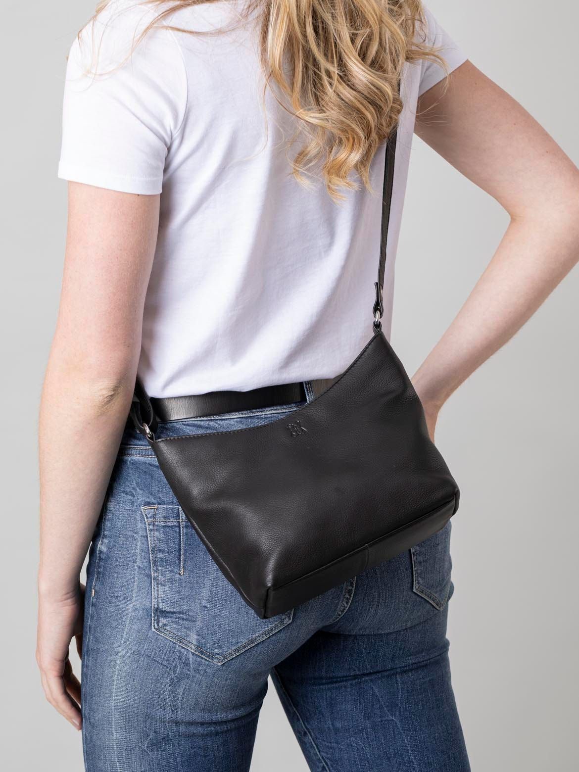 The Fornside is the perfect black cross body bag, crafted from luxuriously soft leather, its minimalist design makes it easy to coordinate with any outfit. A small handbag, it works as a traditional cross body bag, yet the adjustable strap allows it to be carried as a compact shoulder bag, when the occasion requires. Not only does the Fornside handbag look great, it feels fantastic, thanks to our real leather that showcases the natural patina. And practicality is key... we've included a rear zip pocket, and the inside is carefully sectioned, with a zip-top main compartment in the middle, plus two additional sections secured with magnetic studs.