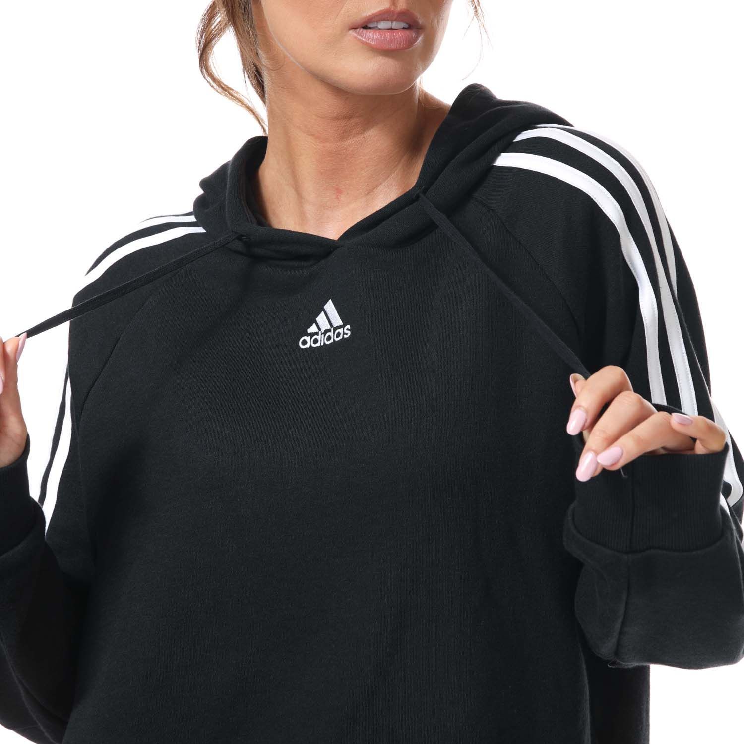 Womens adidas Essentials 3- Stripes Cropped Hoody in black.- Drawcord-adjustable hood.- Long sleeves.- Ribbed cuffs.- 3-Stripes down both arms.- adidas Badge of Sport logo on the chest.- Relaxed fit.- Main Material: 53% Cotton  36% Polyester (Recycled)  11% Rayon. Hood Lining: 100% Cotton. - Ref:GL1460