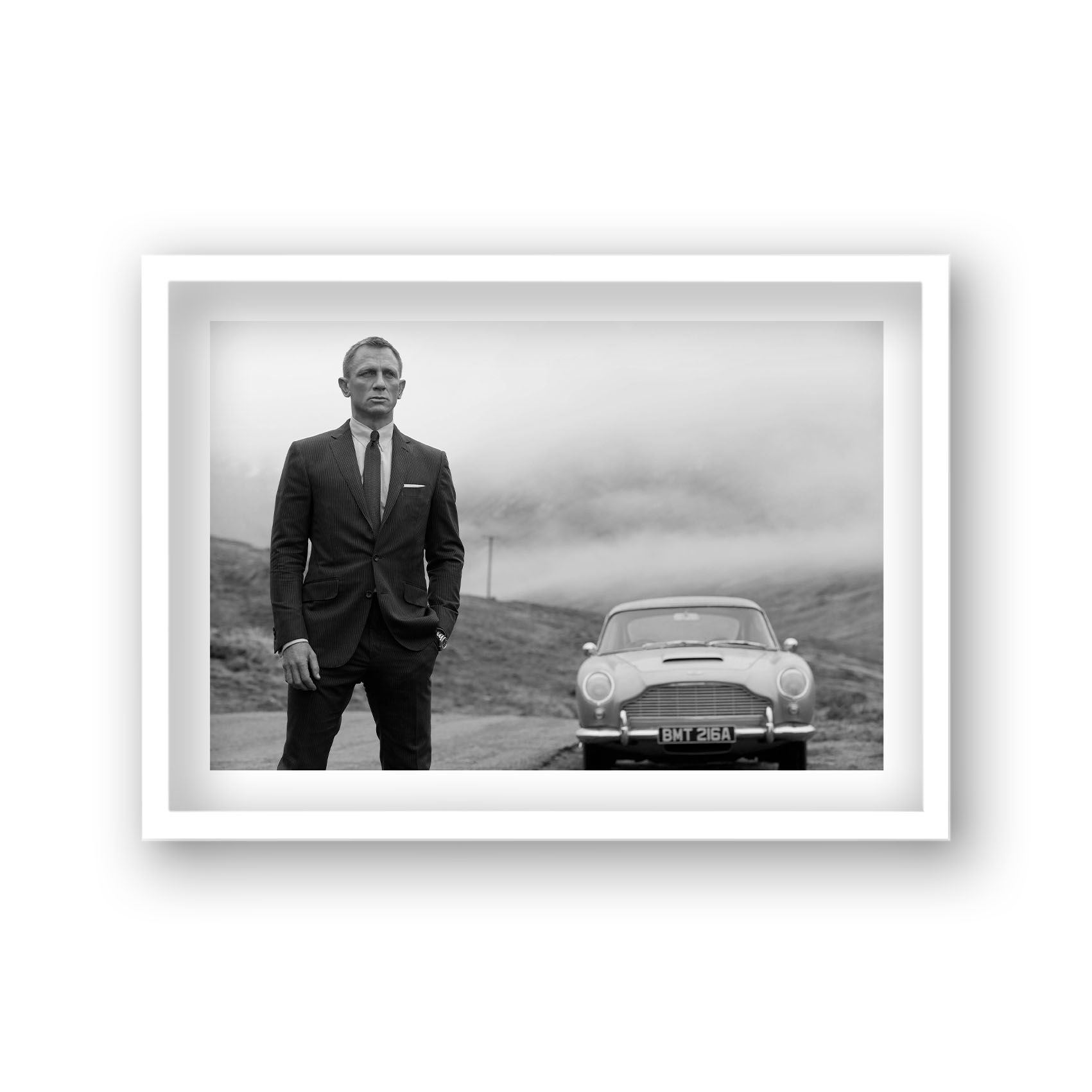 Daniel Craig as James Bond with Aston Martin DB5
