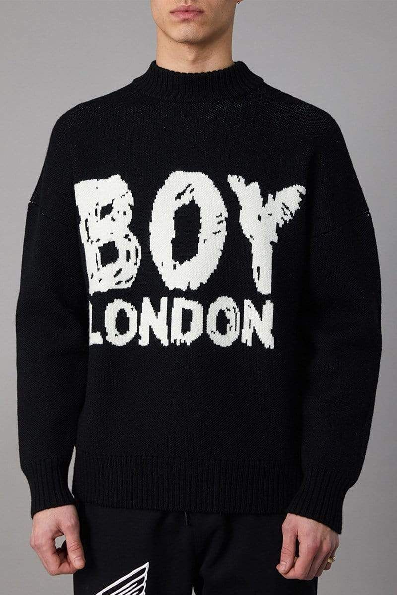 Long sleeve knitted, mock-neck jumper with a scribble variation of the BOY LONDON logo, knitted on front. Rib knit collar, cuffs and hems, drop-shoulder design, constructed from lightweight acrylic/wool fabric