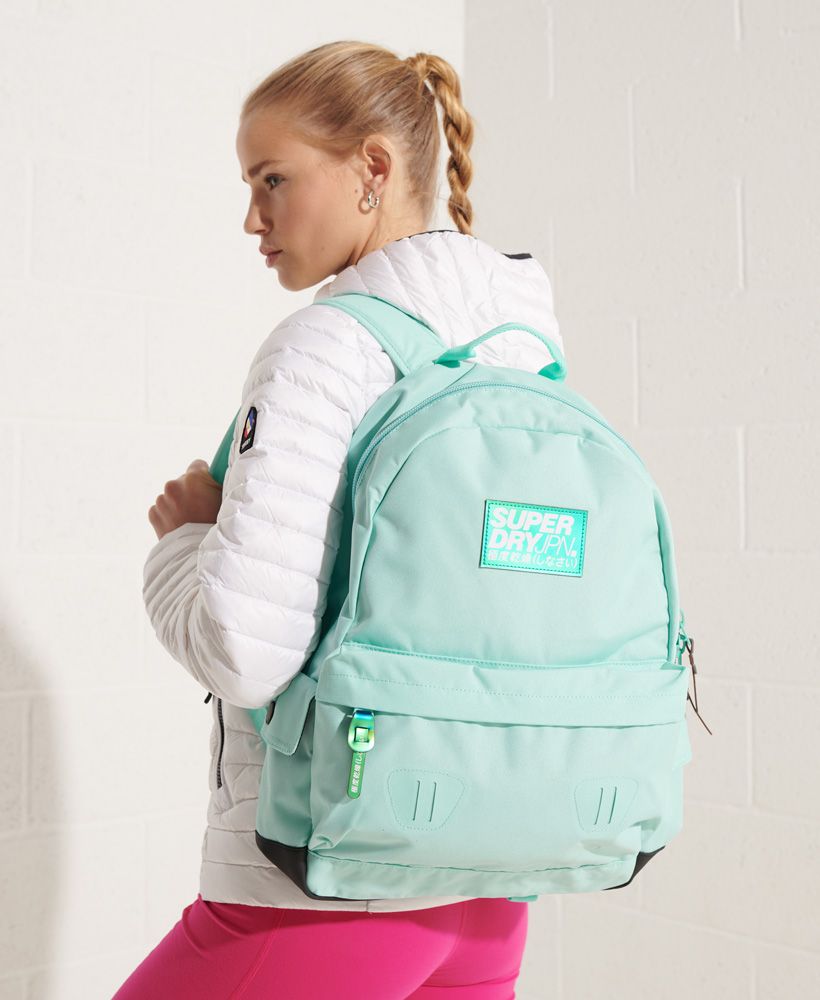 Superdry women's Pearl montana rucksack. This rucksack features a large main zip fastened compartment and a grab handle. This rucksack also features two side compartments with a popper fastening and an outer zip fastened compartment. Finished with a Superdry Logo patch on the front and on one strap.21 litre approximate main compartment capacity.H 46cm x W 30.5cm x D 13.5cm