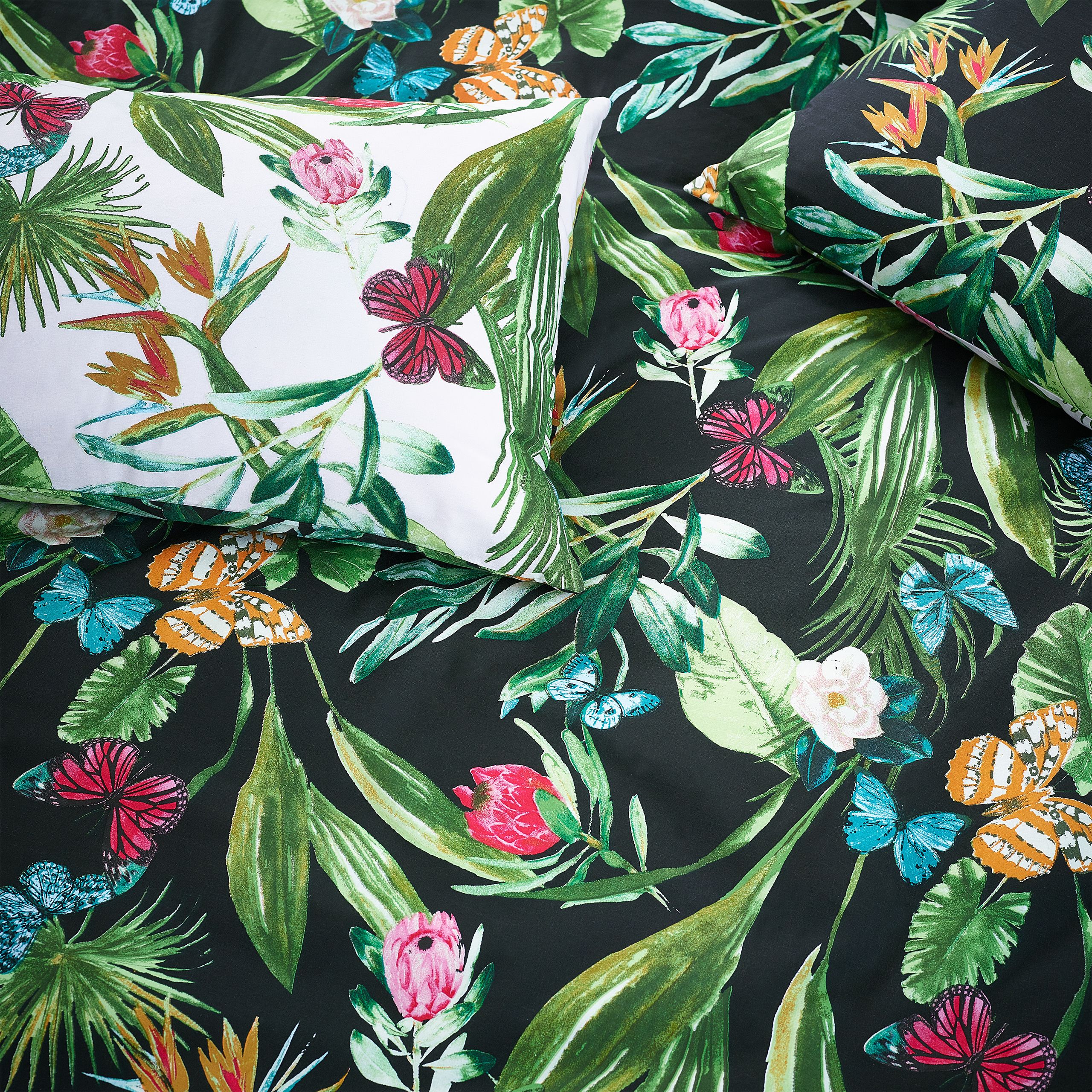 Add a pop of colour to your bedroom with this vibrant botanical duvet cover. The bright butterflies flutter onto the reverse against a neutral base so you can switch the look when you need to.