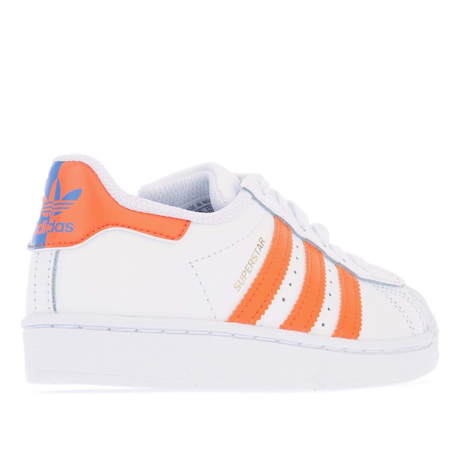 Childrens adidas Originals Superstar Trainers in white blue.- Leather upper.- Lace closure.- Regular fit.- Side metallic stripes.- Signature 3-Stripes to the sidewalls.- Trefoil logos to the tongue and heel. - Grippy rubber sole. - Leather upper  Textile lining  Synthetic sole. - Ref.: FZ0650C