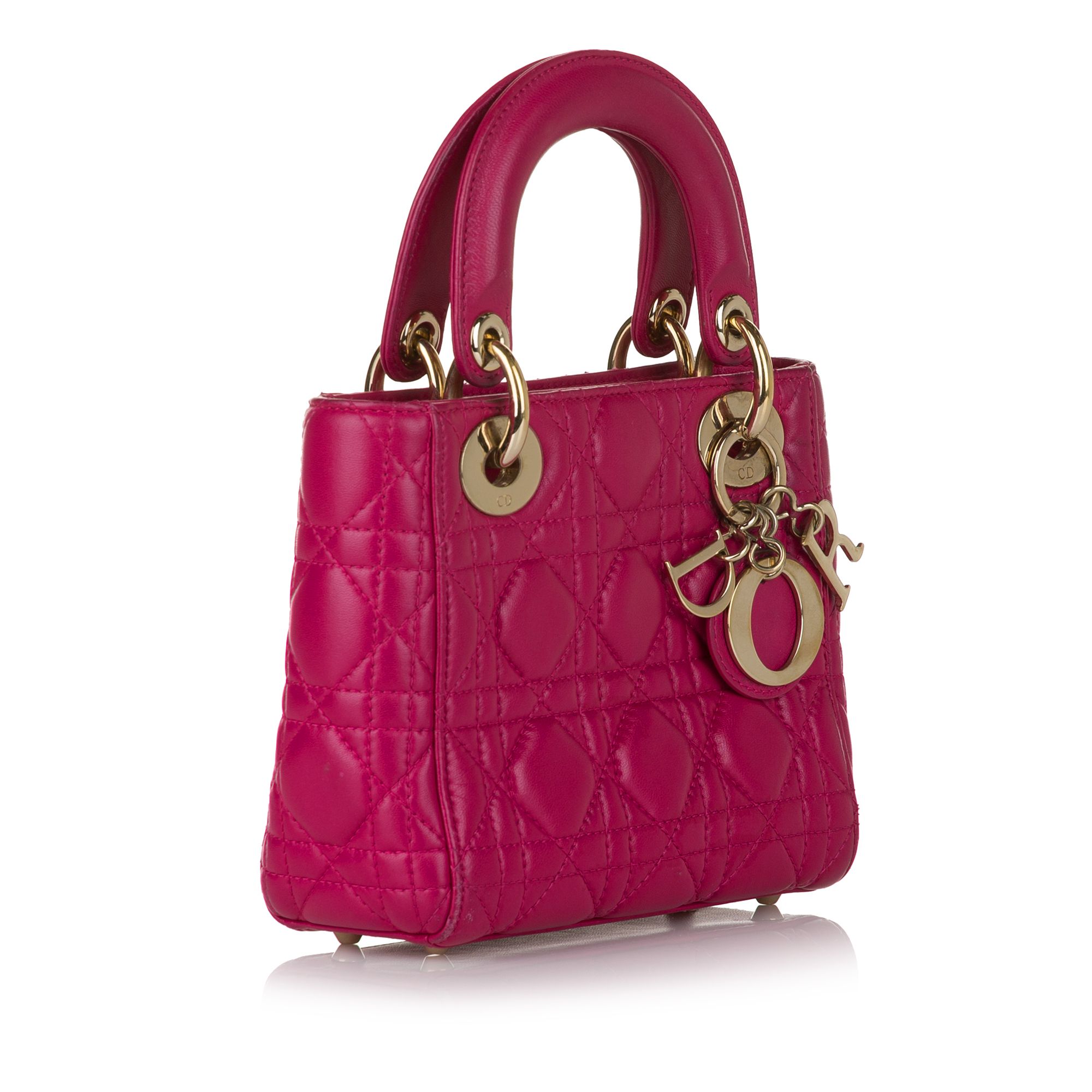 VINTAGE. RRP AS NEW. The Lady Dior features a quilted lambskin leather body, flat top handles, a detachable flat leather strap, a top zip closure, and an interior zip pocket.Exterior Back stained with Transfer Of Color. Exterior Handle Scratched. Exterior Corners Scratched. Exterior Top stained with Transfer Of Color. Embellishment Scratched. Exterior Back stained with Transfer Of Color. Exterior Handle Scratched. Exterior Corners Scratched. Exterior Top stained with Transfer Of Color. Embellishment Scratched. 

Dimensions:
Length 14cm
Width 17cm
Depth 7cm
Hand Drop 7cm
Shoulder Drop 65cm

Original Accessories: Shoulder Strap

Color: Pink
Material: Leather x Lambskin Leather
Country of Origin: Italy
Boutique Reference: SSU161183K1342


Product Rating: GoodCondition

Certificate of Authenticity is available upon request with no extra fee required. Please contact our customer service team.