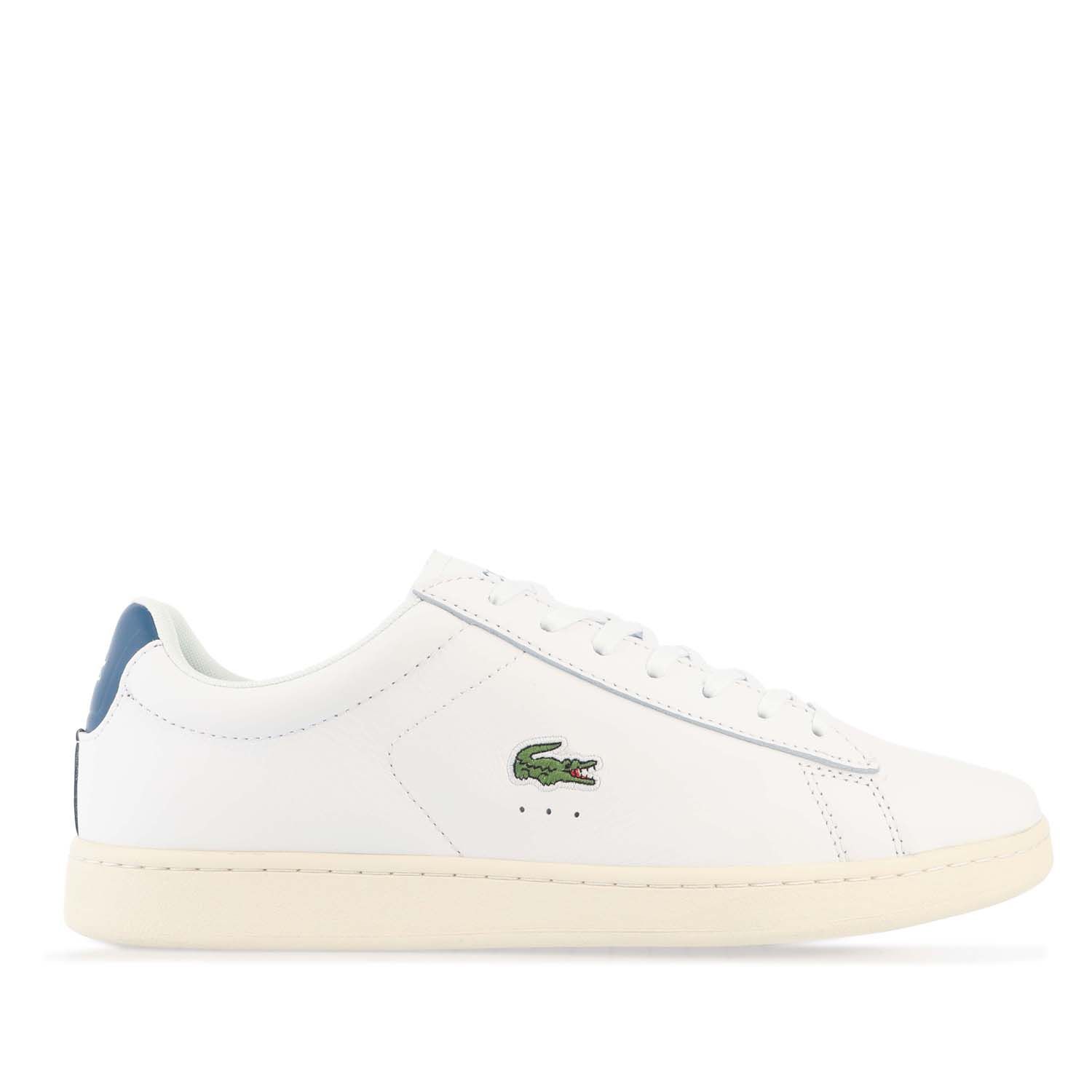 Mens Lacoste Carnaby Leather Accent Heel Trainers in white - dark blue.- Premium leather upper.- Lace up fastening with comfortable flat laces.- Padded collar and tongue.- Piqué-inspired mesh lining.- Removable Ortholite sockliner for comfort and odour control.- Rubber cupsole with stitching.- Lacoste lettered branding at tongue.- Contrast heel patch with printed crocodile.- Embroidered crocodile to side.- Leather upper  Textile lining  Synthetic sole.- Ref: 7-43SMA0017X96
