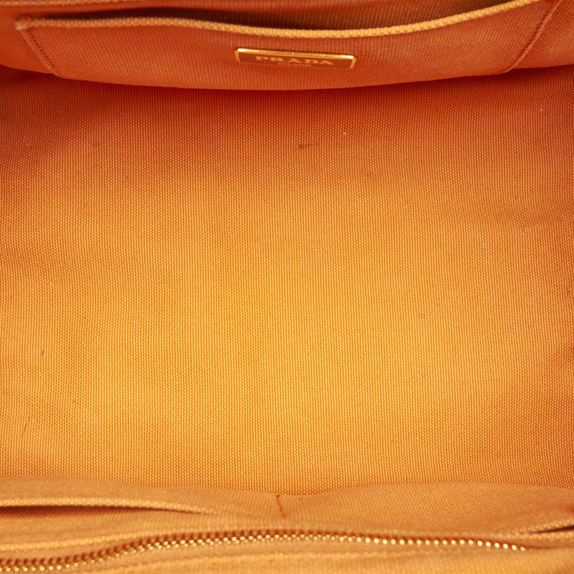 VINTAGE. RRP AS NEW. The Canapa satchel features a studded canvas body, rolled handles, a detachable shoulder strap, an open top, and interior zip and slip pockets.Exterior back is discolored and stained with transfer of color. Exterior bottom is discolored and stained with transfer of color. Exterior corners is discolored. Exterior front is discolored and stained with transfer of color. Exterior handle is discolored and stained with transfer of color. Exterior side is discolored and stained with transfer of color. Studs is scratched and tarnished. Zipper is tarnished. Interior lining is discolored and stained with pen mark and transfer of color. Interior pocket is discolored.

Dimensions:
Length 21cm
Width 33cm
Depth 20.5cm
Hand Drop 10cm
Shoulder Drop 54cm

Original Accessories: Shoulder Strap

Serial Number: none
Color: Orange
Material: Fabric x Canvas
Country of Origin: ITALY
Boutique Reference: SSU165408K1342


Product Rating: GoodCondition

Certificate of Authenticity is available upon request with no extra fee required. Please contact our customer service team.