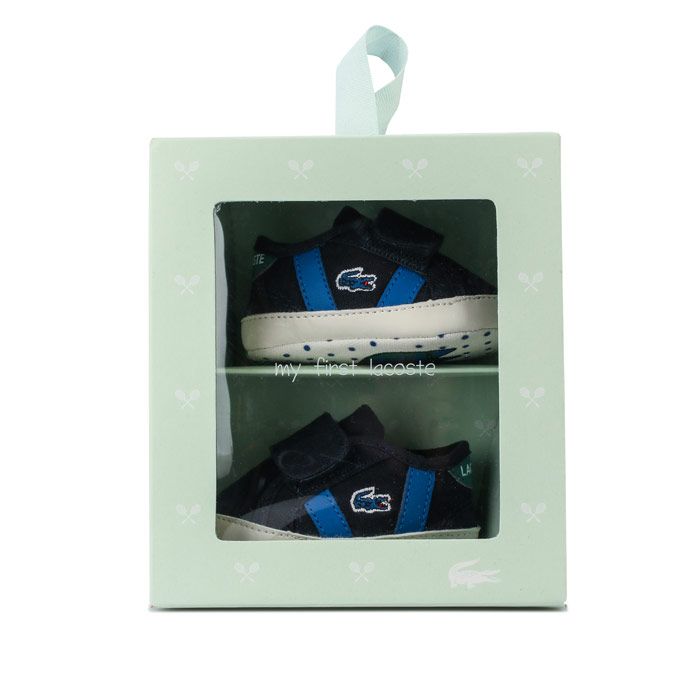 Baby Boys Sideline Crib Trainers – Hook and loop fastening. – Presentation Box. – Soft Sole. – Lacoste Logo to side –Textile Upper – Textile lining – Synthetic sole – Ref: 739CUB00012S3