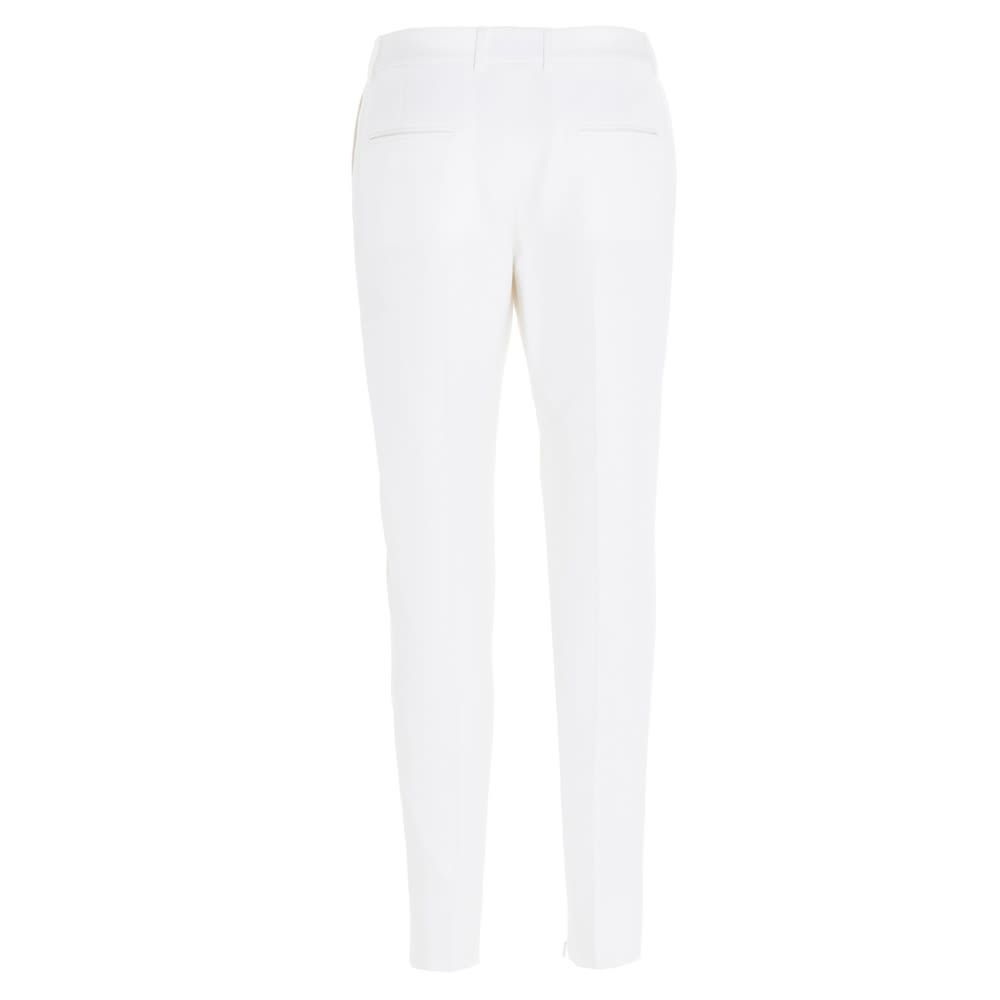 Saint Laurent virgin wool trousers with a satin band at the side, a skinny style with a zip and hook closure.