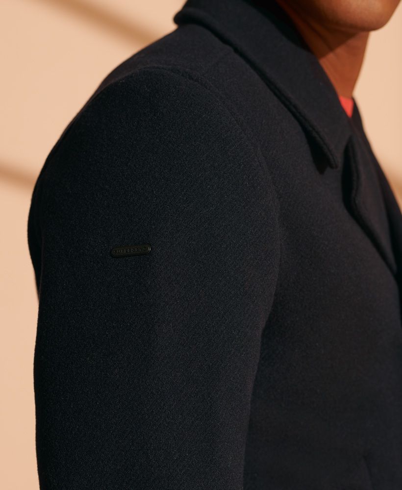 Made from a wool-rich blend, this peacoat features a classic double breasted design, to keep the cold out this season.Double breasted designButton fasteningButton cuffsThree pocket designSignature metal logo badge