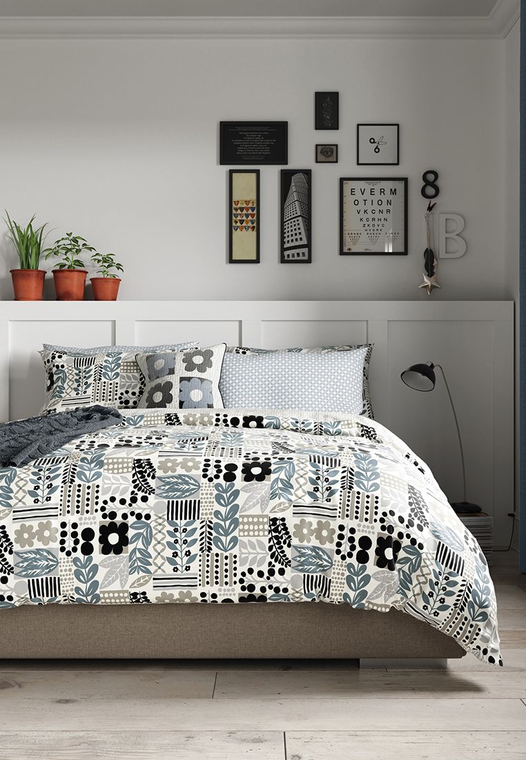 A modern patchwork style design with a cool Scandi twist. The all-over placement of leaves and flowers make up a graphic pattern in a contemporary colourway of charcoal, silver, white and steely blue. The design reverses to an abstract vertical stripe which adds a calming touch. Includes Pillowcase(s). Machine Washable. Made in Pakistan.
